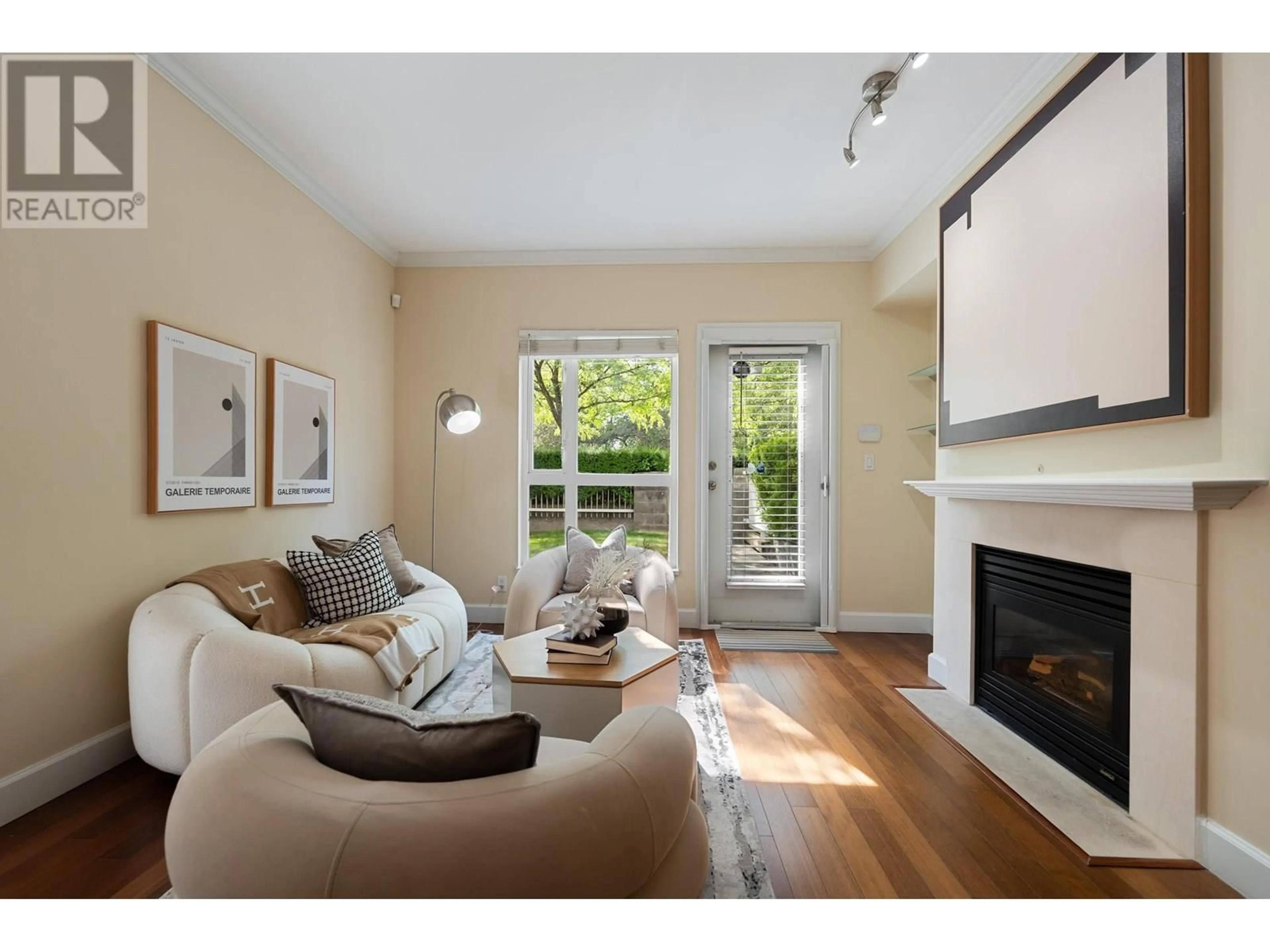 Living room with furniture, wood/laminate floor for 103 - 6198 ASH STREET, Vancouver British Columbia V5Z3G9