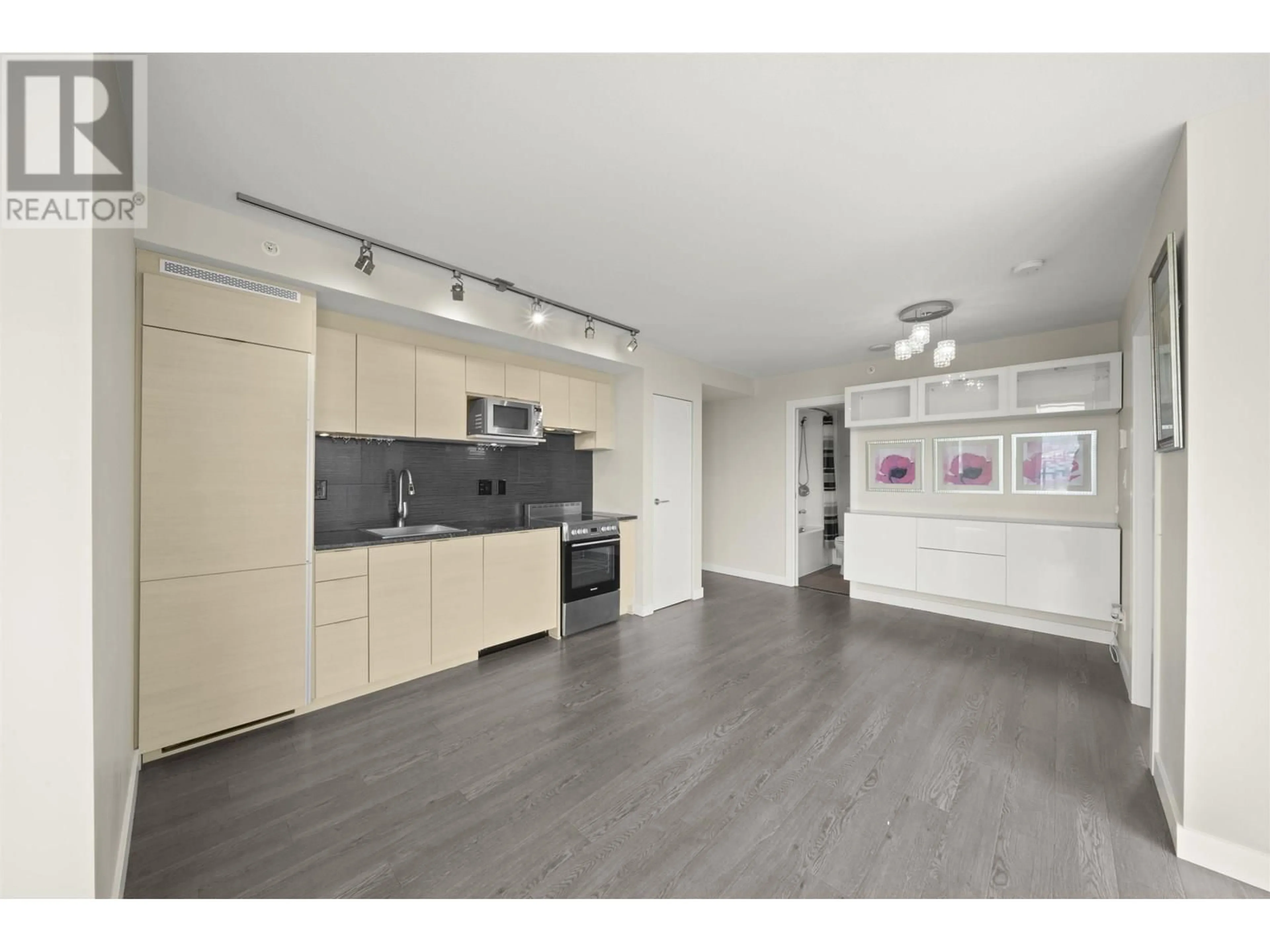 Open concept kitchen, wood/laminate floor for 2407 - 489 INTERURBAN WAY, Vancouver British Columbia V5X0C7