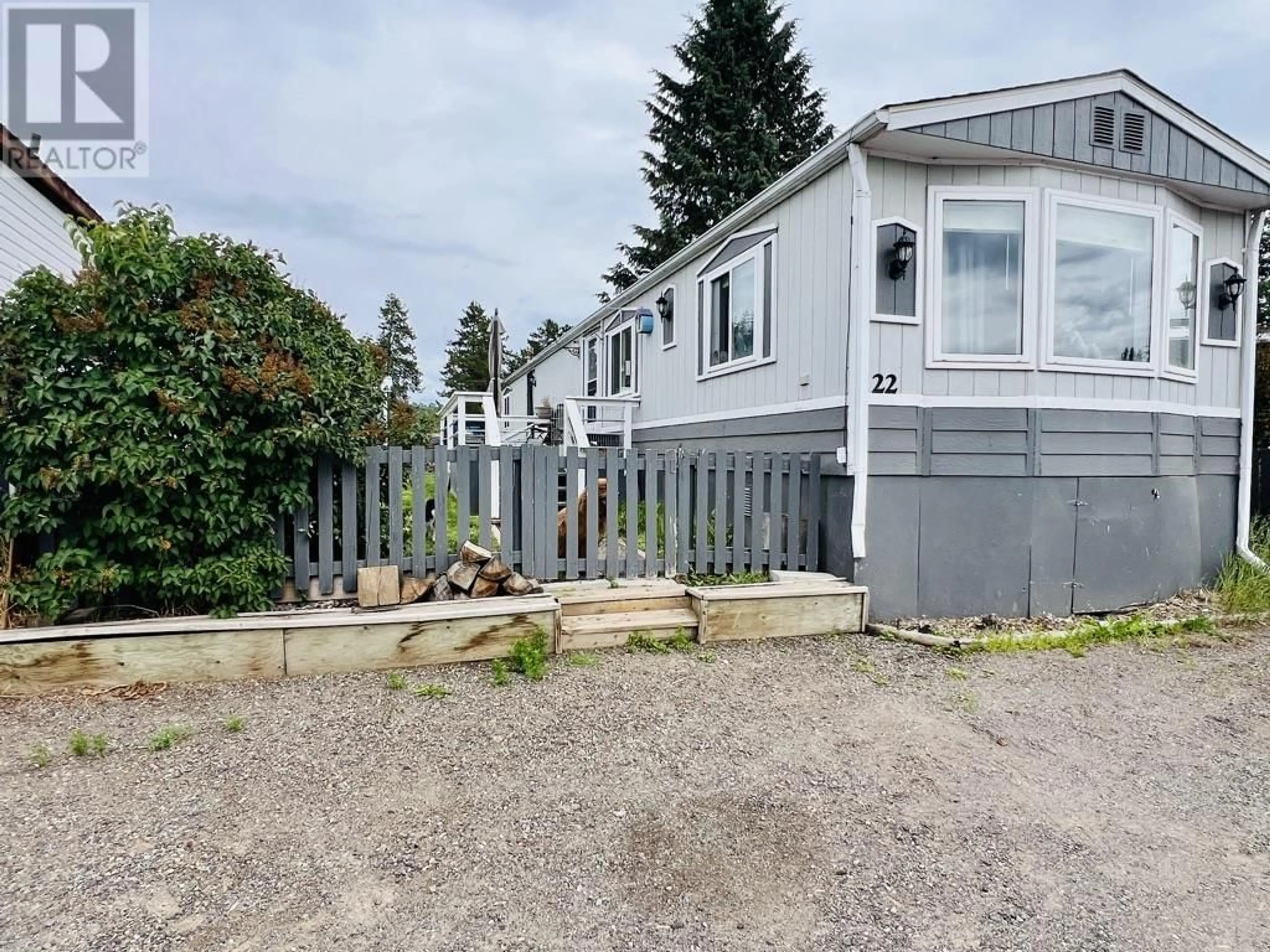 A pic from outside/outdoor area/front of a property/back of a property/a pic from drone, street for 22 - 95 LAIDLAW ROAD, Smithers British Columbia V0J2N6