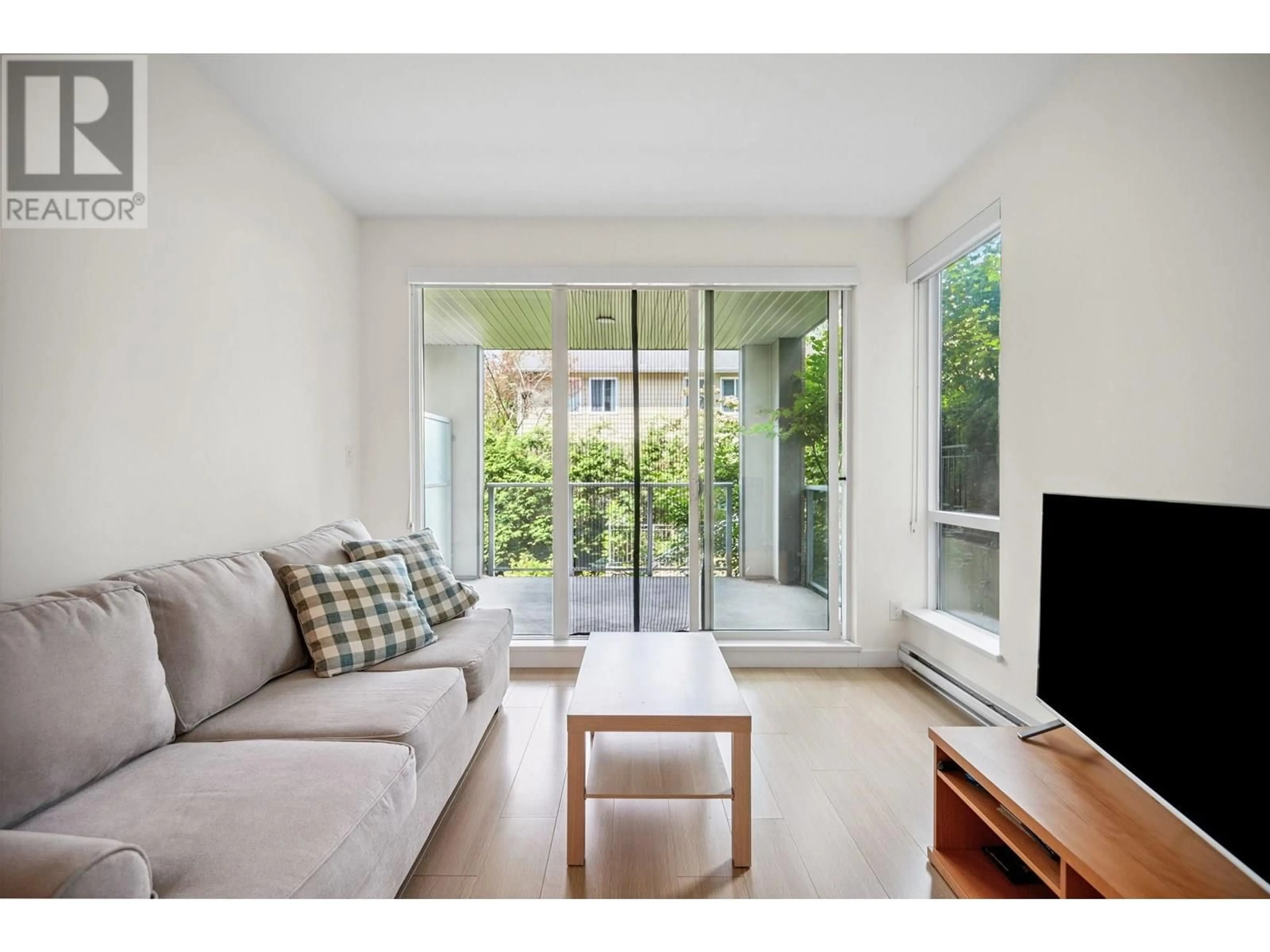 Living room with furniture, wood/laminate floor for 206 - 5460 BROADWAY, Burnaby British Columbia V5B0B4