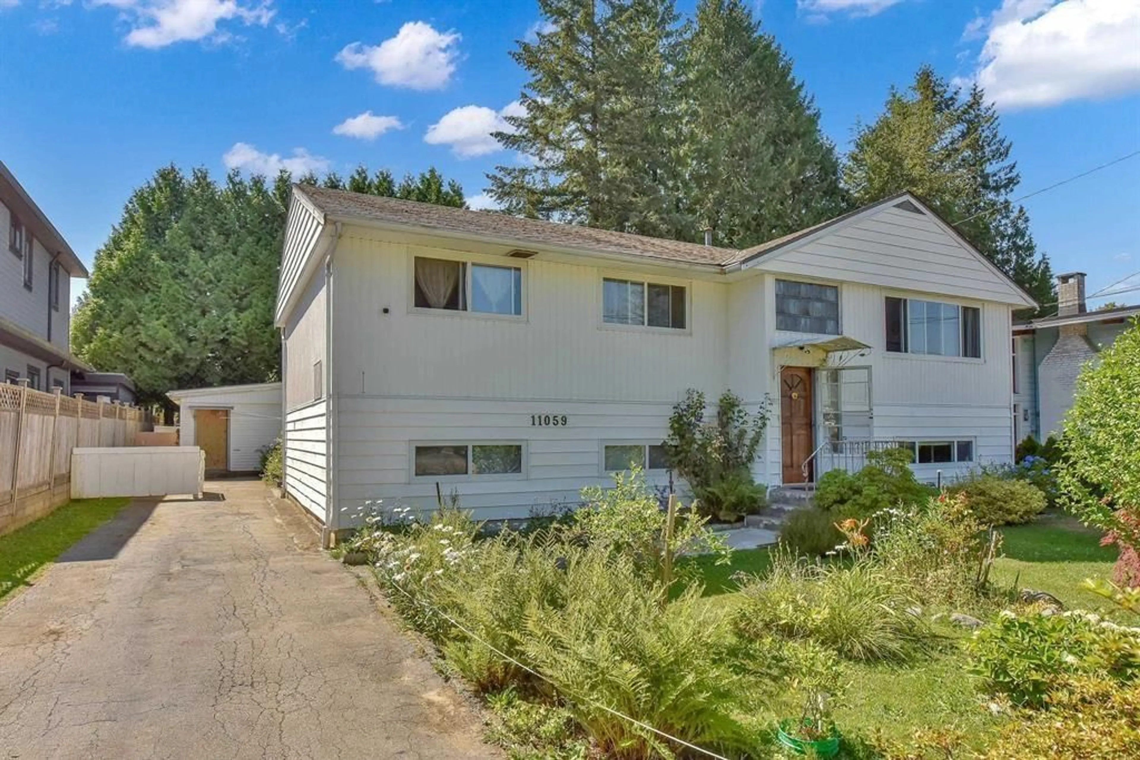 Home with vinyl exterior material, street for 11059 146A, Surrey British Columbia V3R3V3