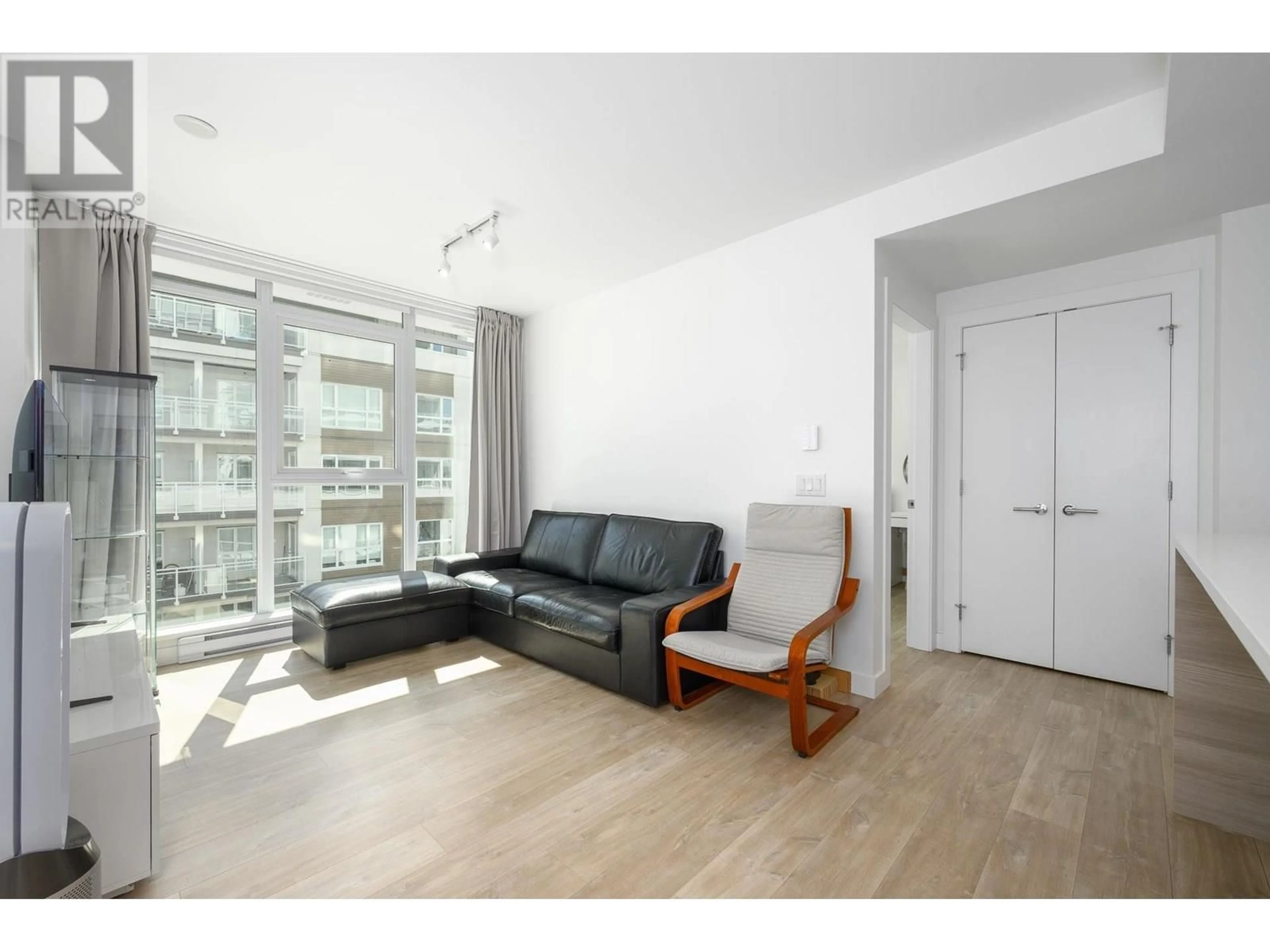Living room with furniture, wood/laminate floor for 407 - 525 FOSTER AVENUE, Coquitlam British Columbia V3J0H6