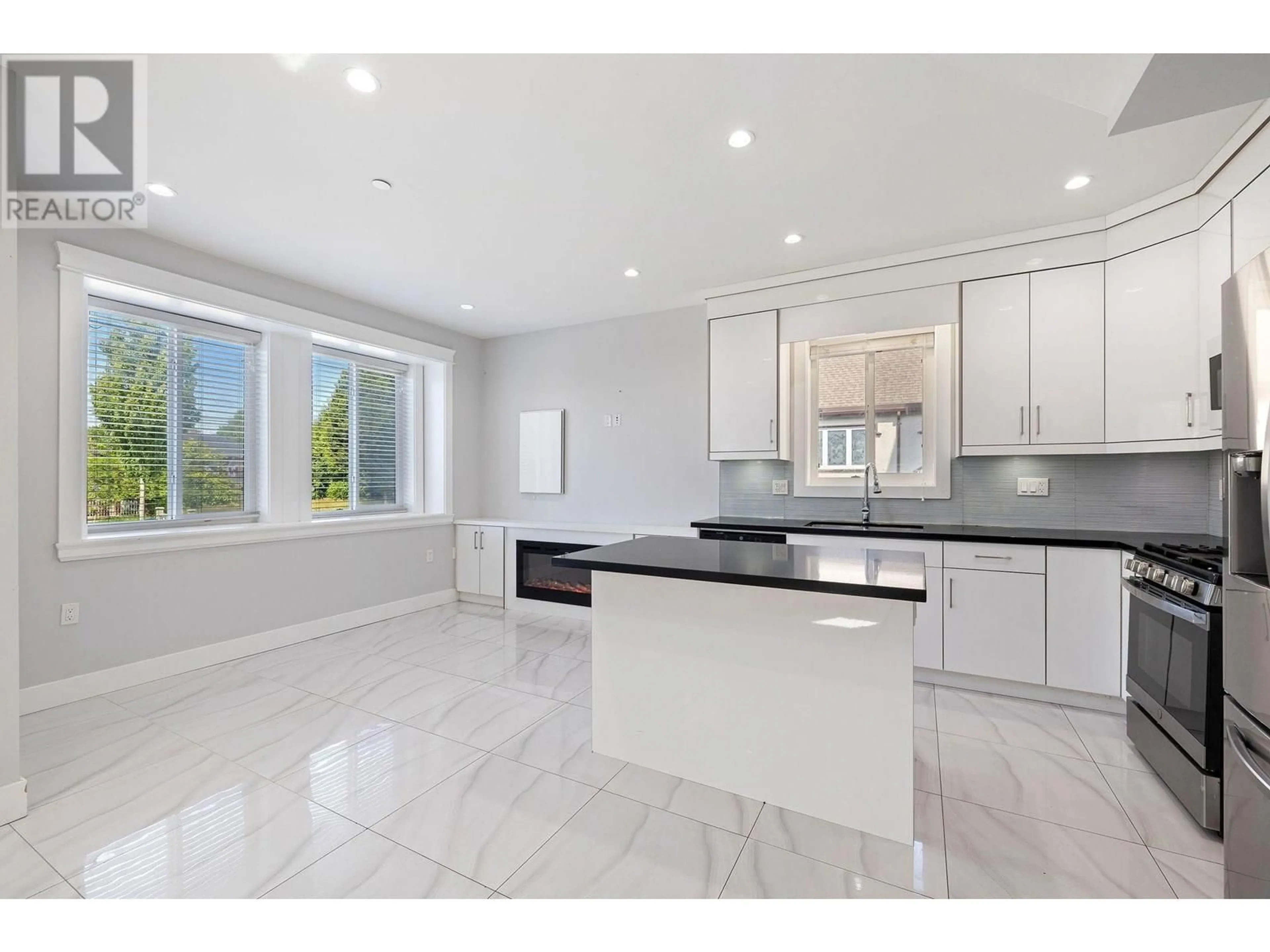 Open concept kitchen, ceramic/tile floor for 1 - 2430 41 AVENUE, Vancouver British Columbia V5R2W4