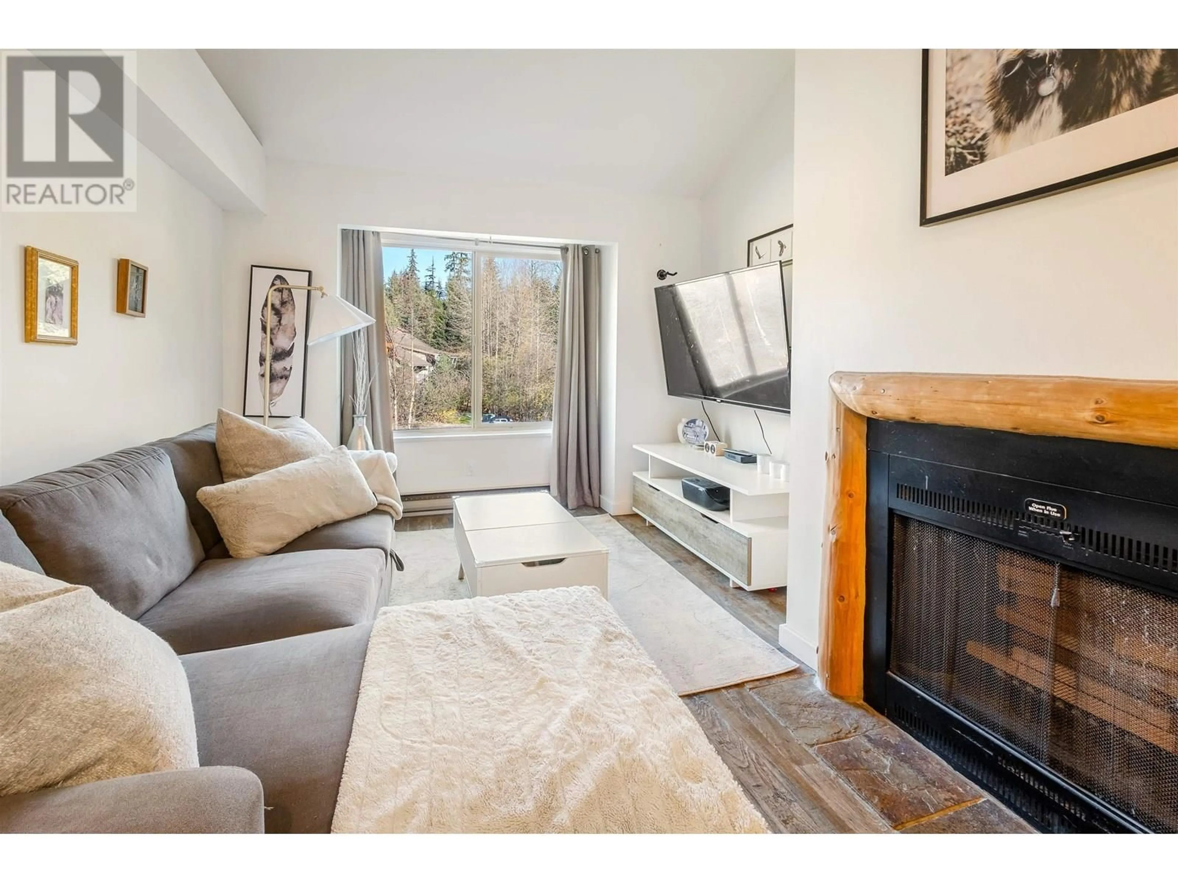 Living room with furniture, wood/laminate floor for 312 - 2021 KAREN CRESCENT, Whistler British Columbia V8E0H1