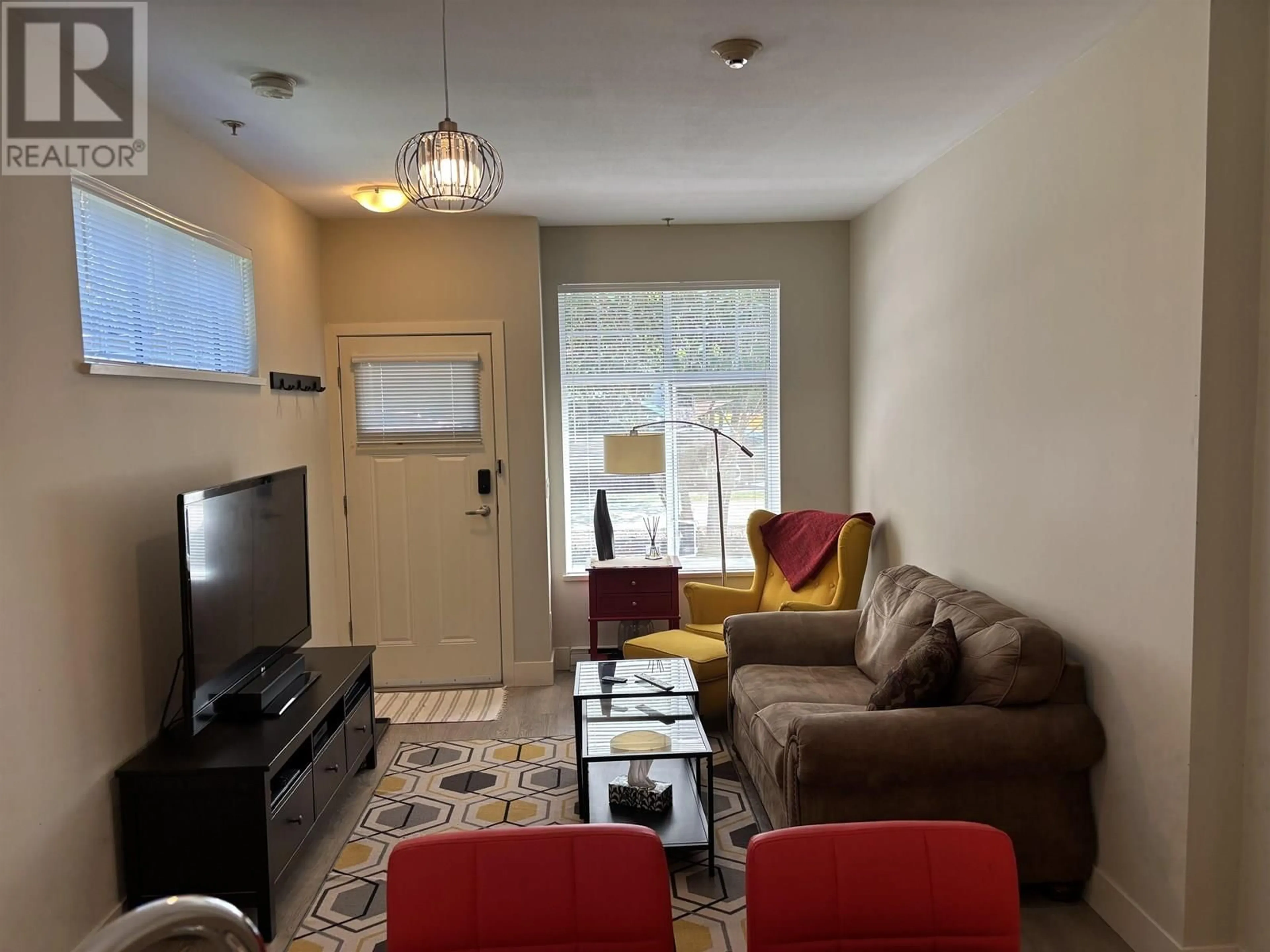 Living room with furniture, unknown for 106 - 4255 SARDIS STREET, Burnaby British Columbia V5H1K6
