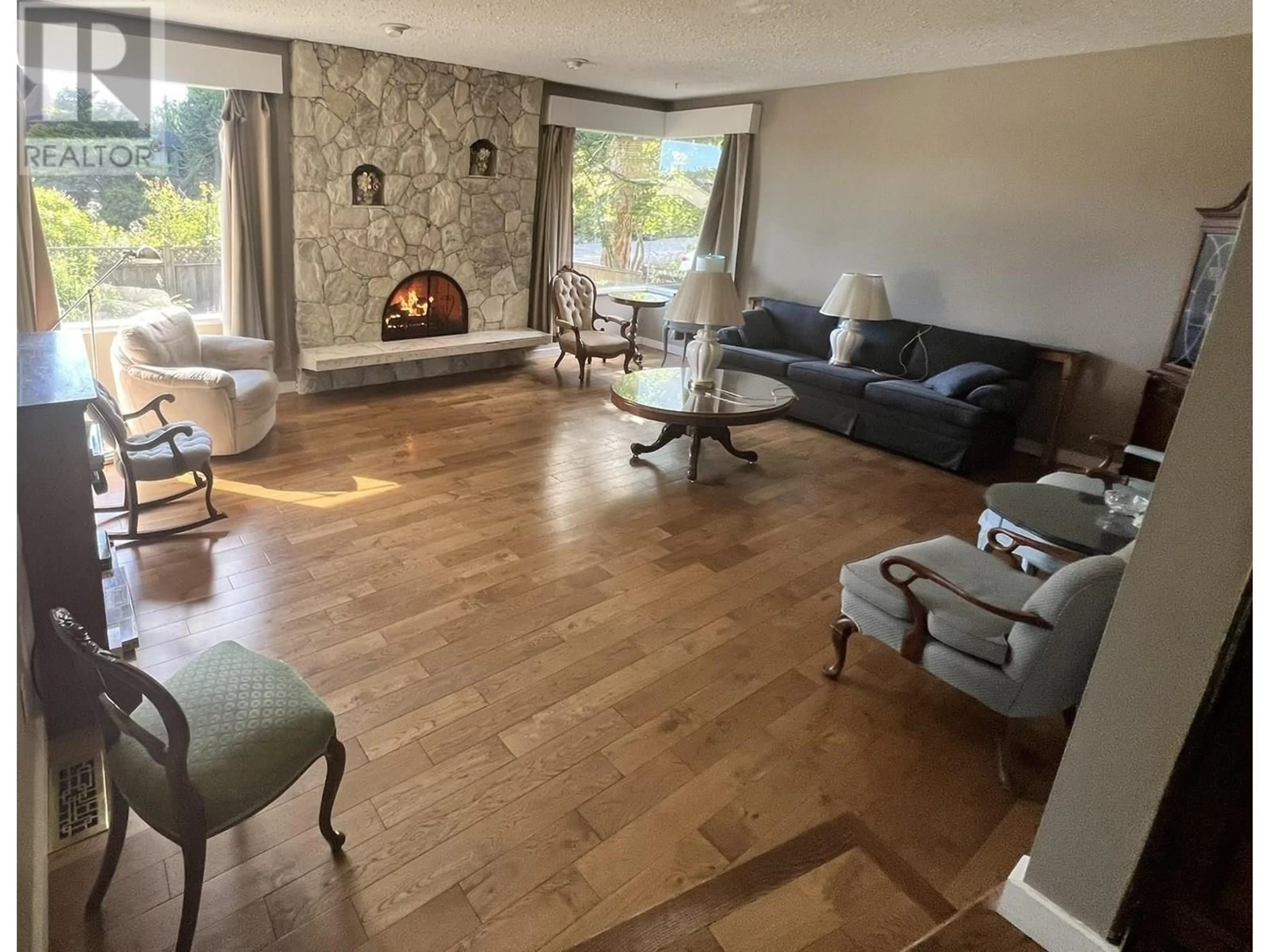 Living room with furniture, wood/laminate floor for 4305 STAULO CRESCENT, Vancouver British Columbia V6N3S1