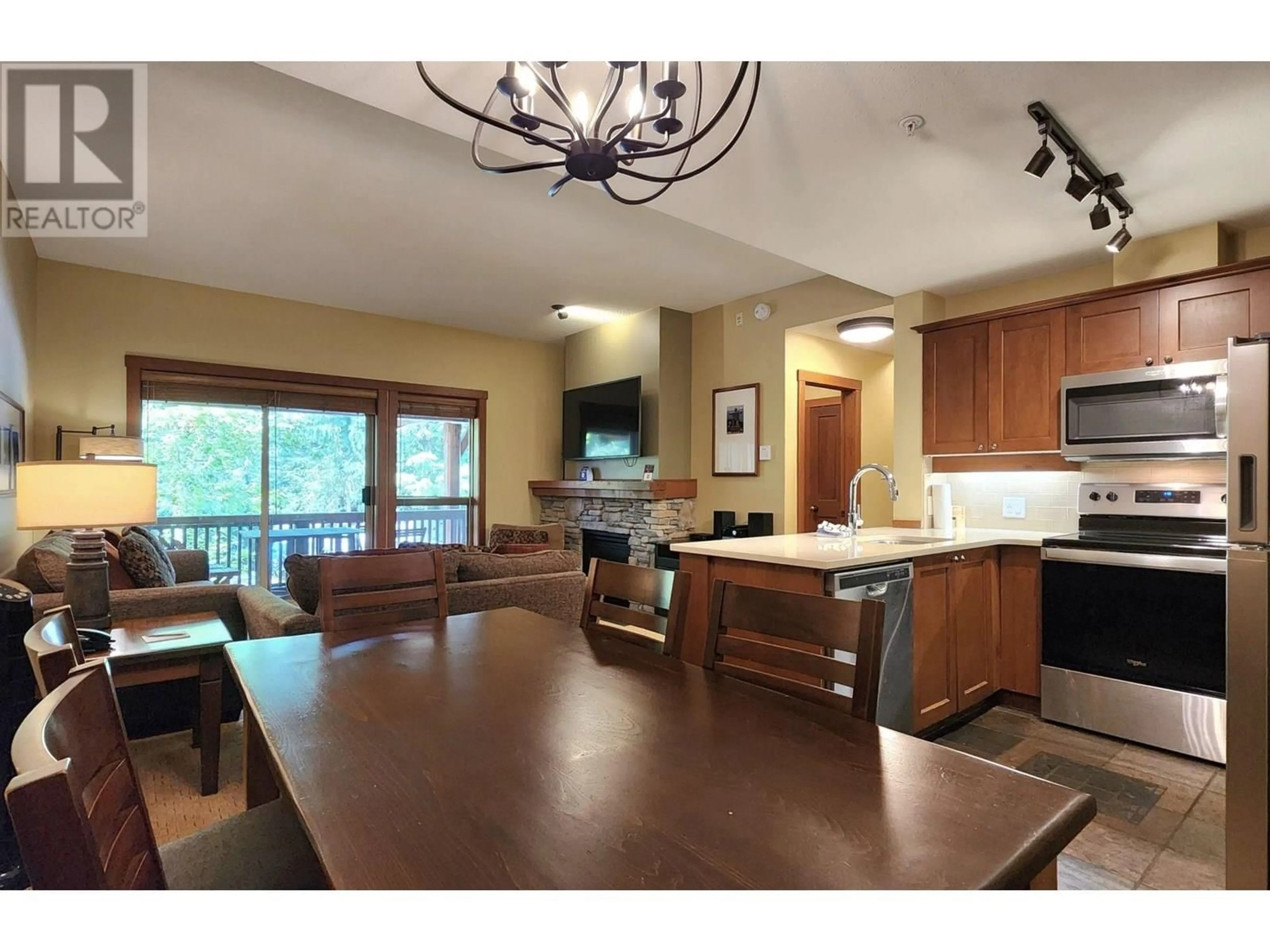 Open concept kitchen, wood/laminate floor for 103 G3 - 4653 BLACKCOMB WAY, Whistler British Columbia V8E0Y9