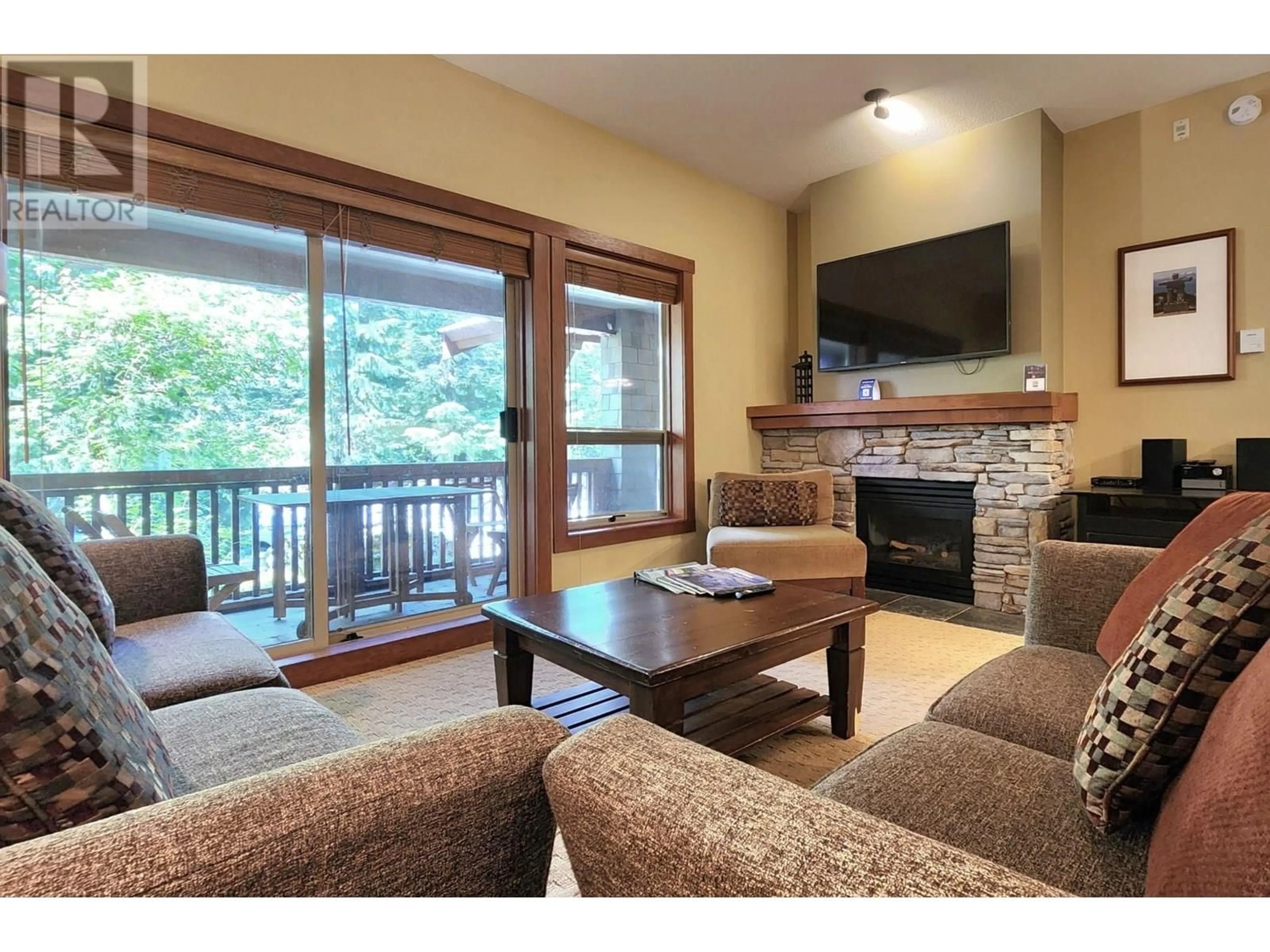 Living room with furniture, wood/laminate floor for 103 G3 - 4653 BLACKCOMB WAY, Whistler British Columbia V8E0Y9