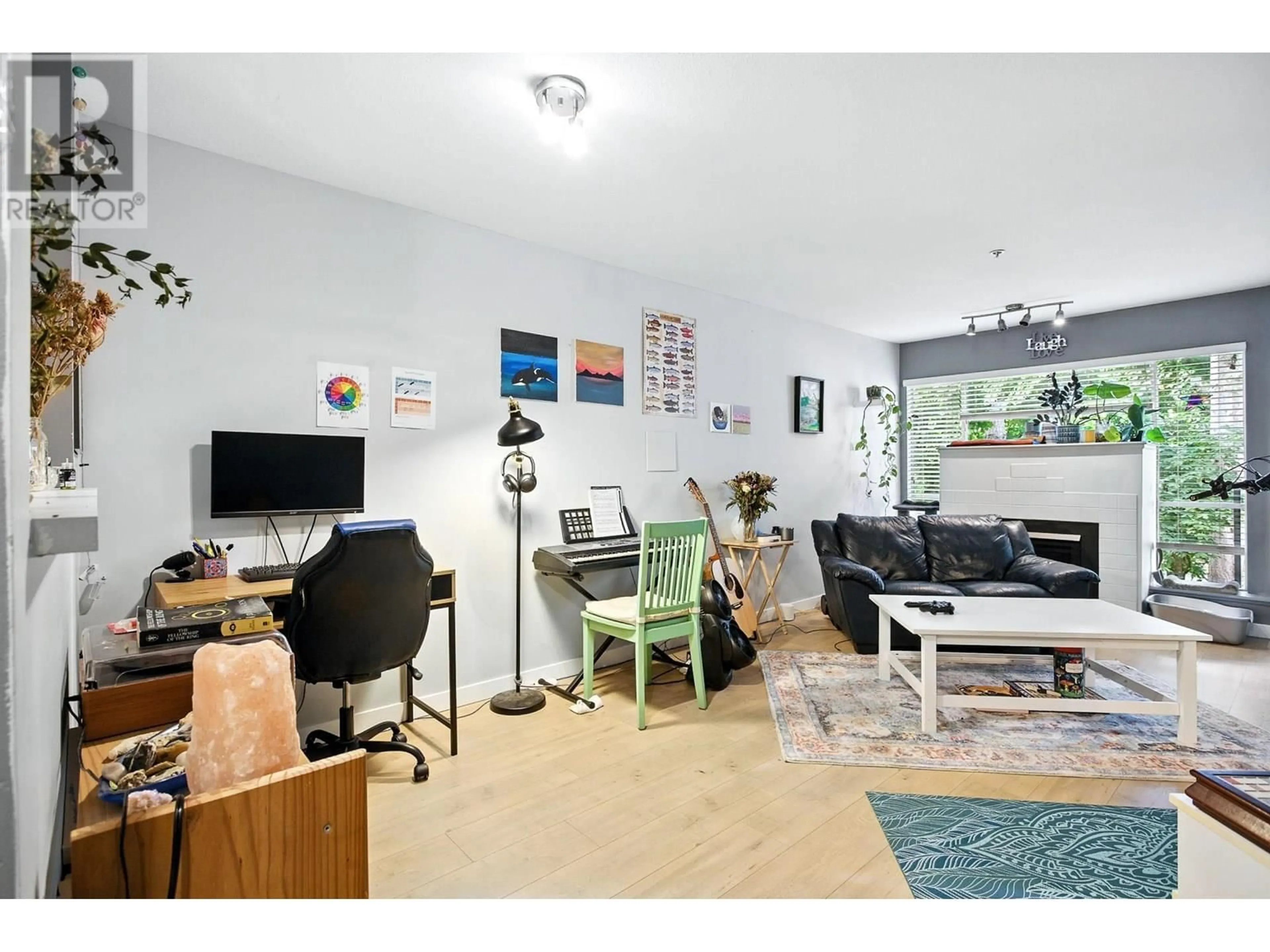 Living room with furniture, wood/laminate floor for 209 - 2401 HAWTHORNE AVENUE, Port Coquitlam British Columbia V3C6E9