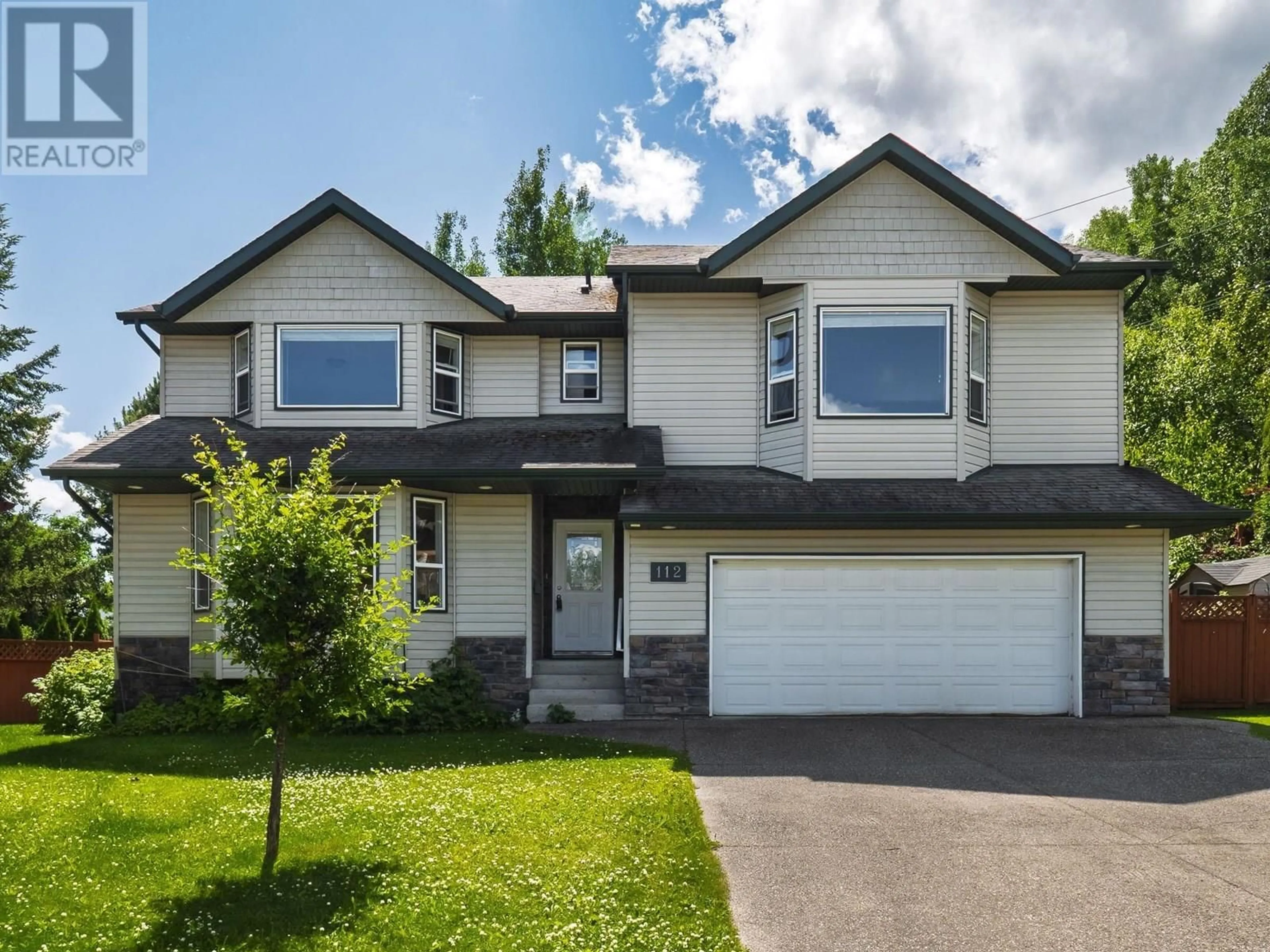 Home with vinyl exterior material, street for 112 - 1299 OSPIKA BOULEVARD, Prince George British Columbia V2M7G2