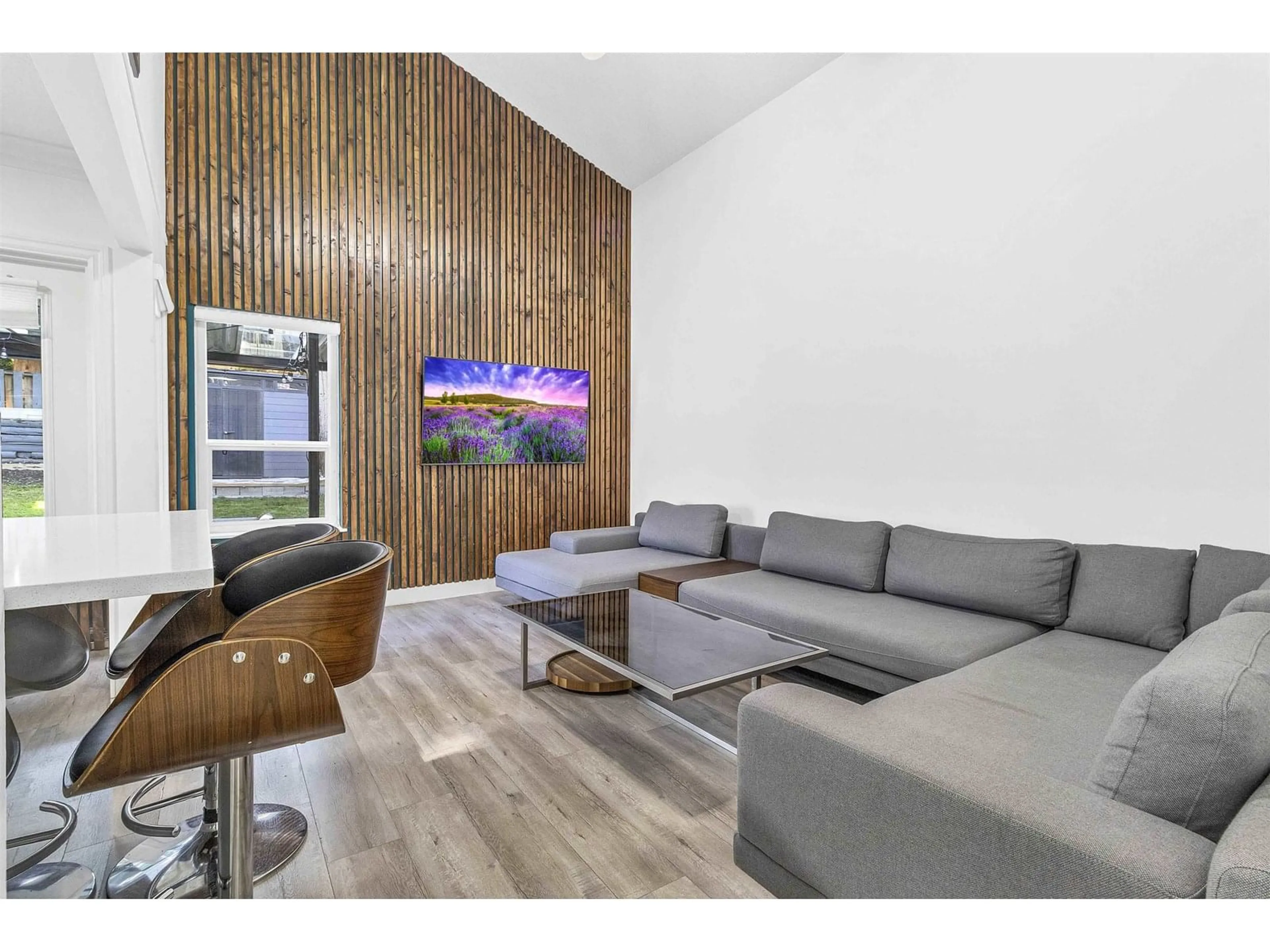 Living room with furniture, wood/laminate floor for 8025 139A, Surrey British Columbia V3W6P9