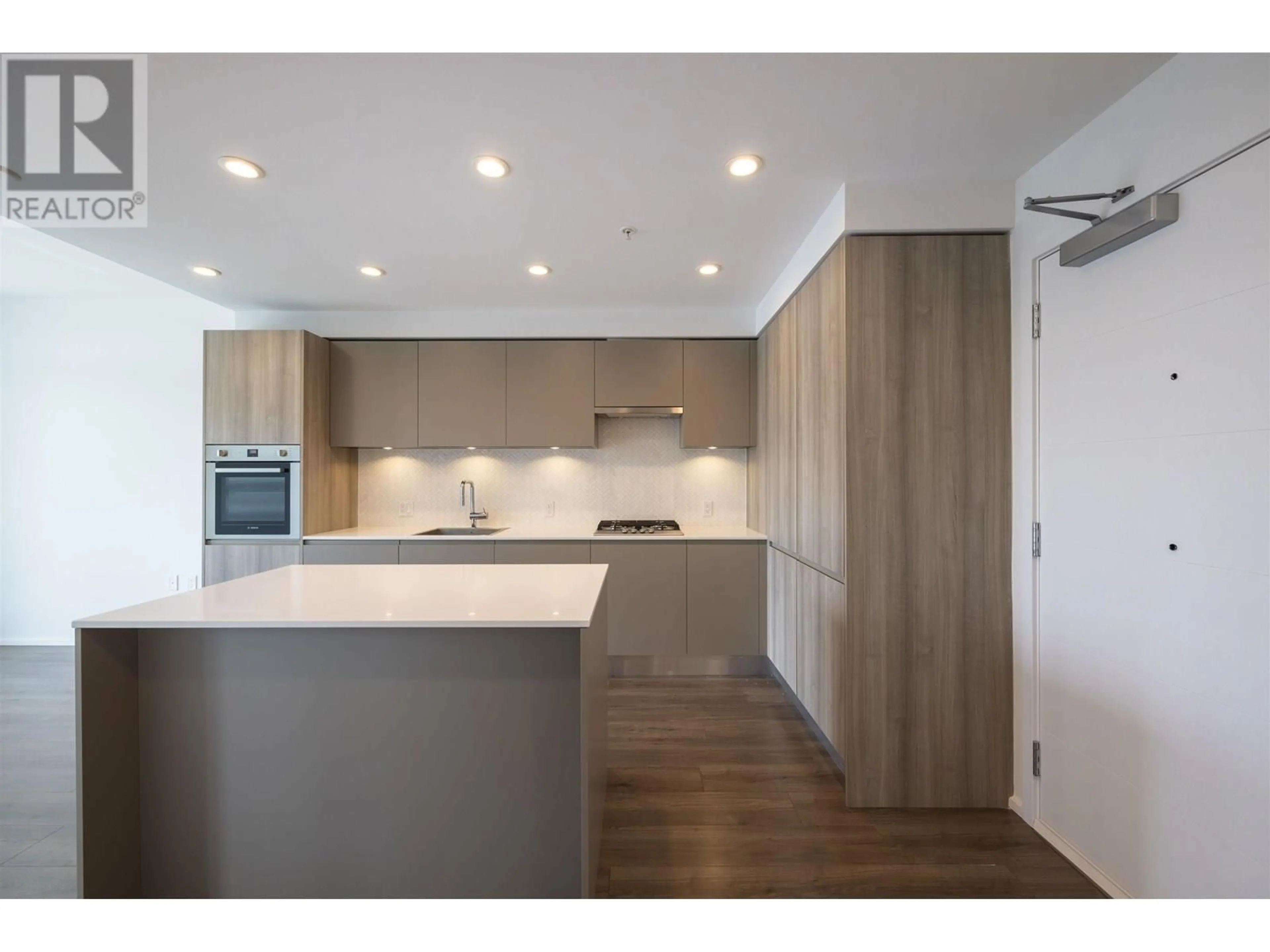Open concept kitchen, wood/laminate floor for 410 - 3809 EVERGREEN PLACE, Burnaby British Columbia V3J0M1