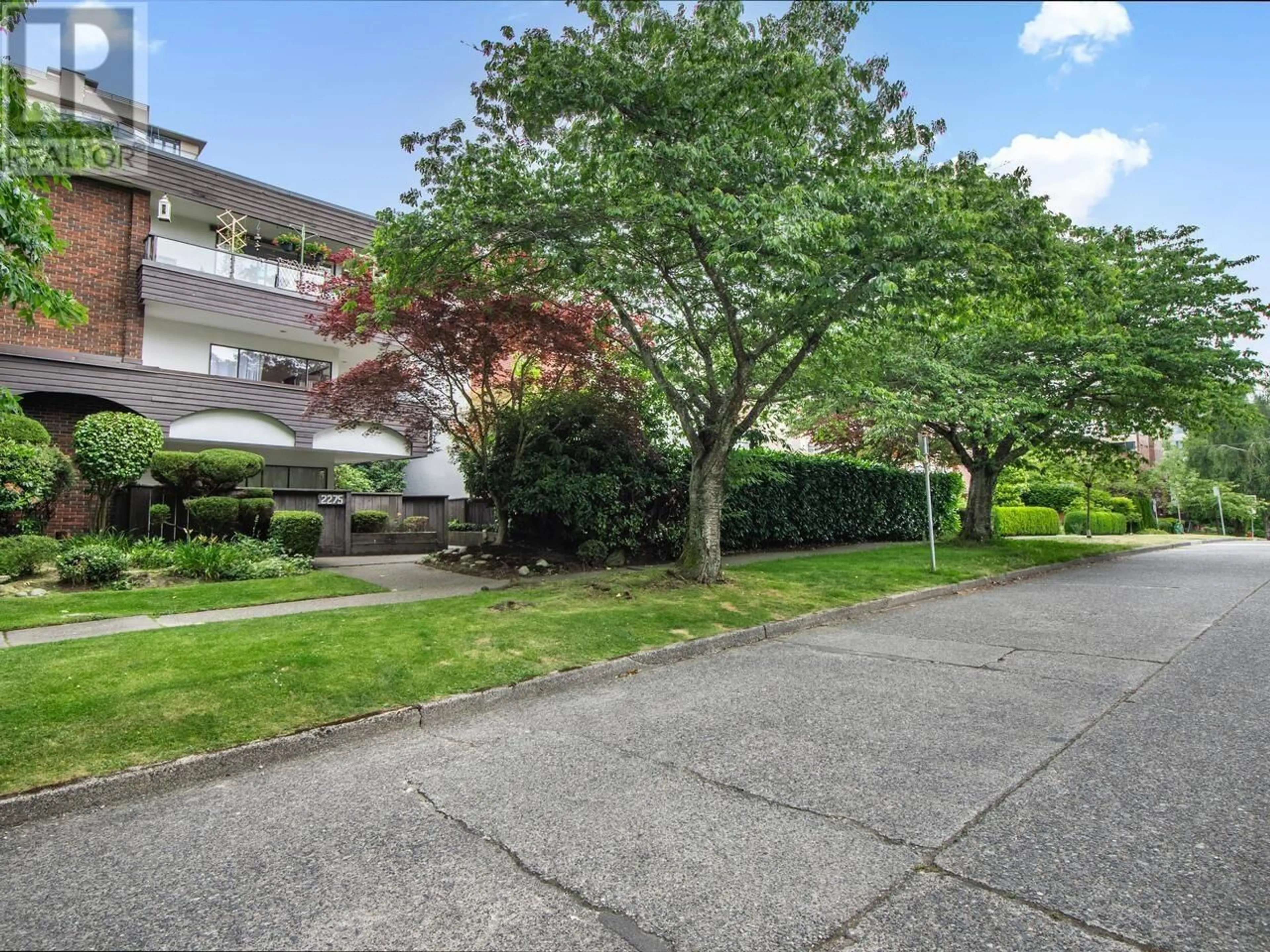 A pic from outside/outdoor area/front of a property/back of a property/a pic from drone, street for 102 - 2275 40TH AVENUE, Vancouver British Columbia V6M1W7