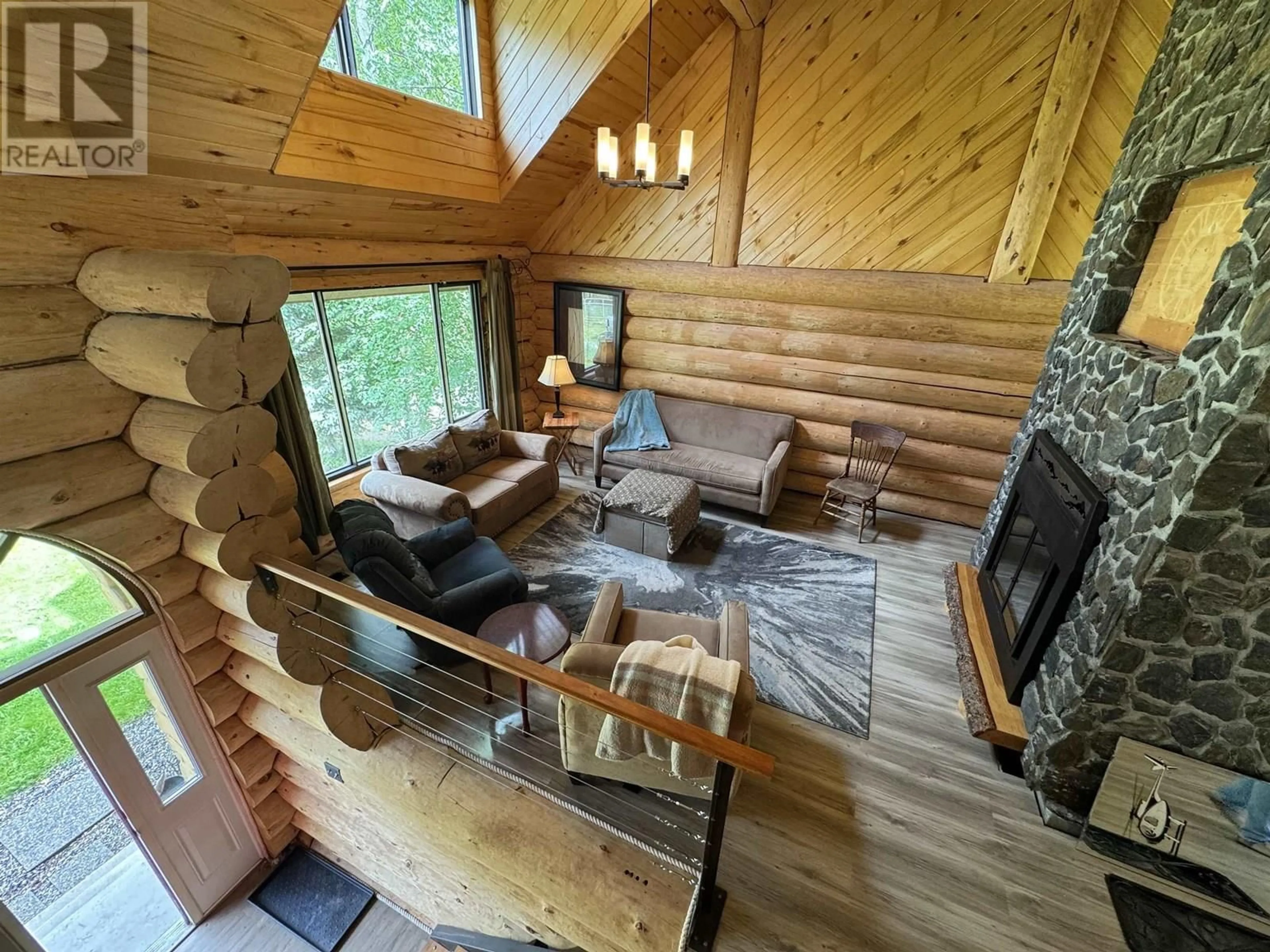 Living room with furniture, wood/laminate floor for 2179 MCPHERSON WYND, Williams Lake British Columbia V2G4V7