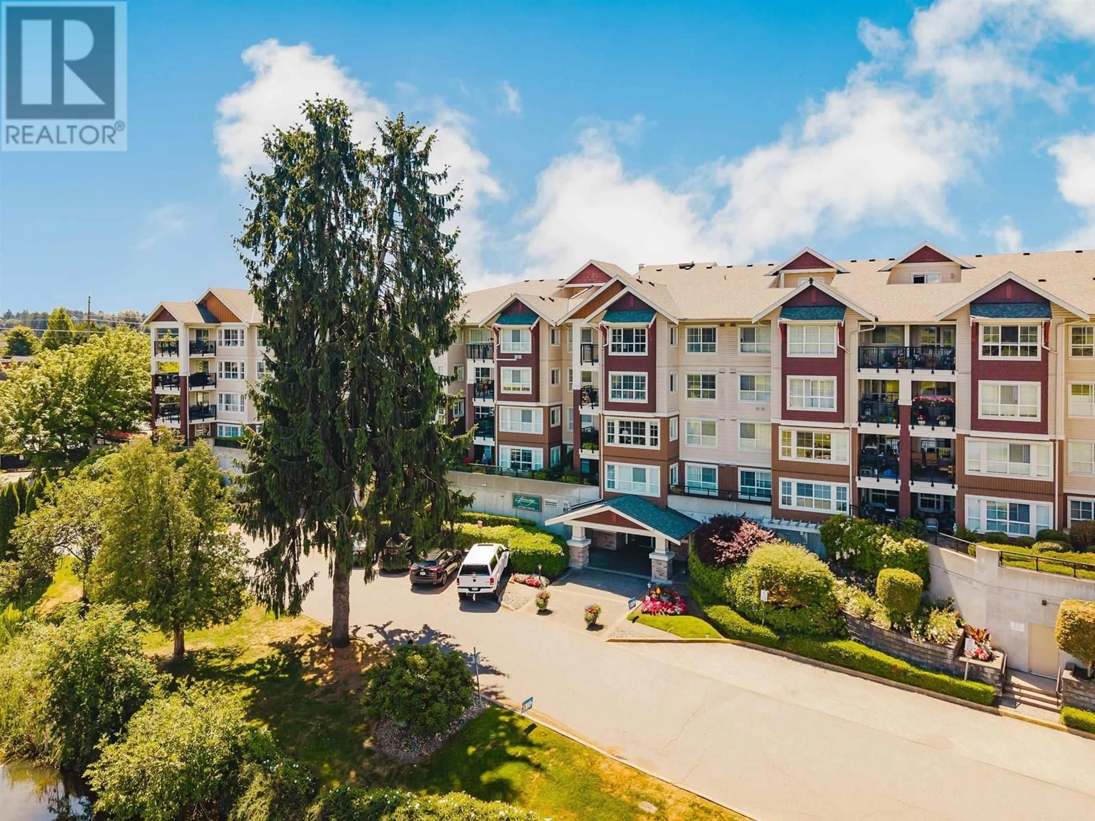 A pic from outside/outdoor area/front of a property/back of a property/a pic from drone, mountain view for 205 - 19677 MEADOW GARDENS WAY, Pitt Meadows British Columbia V3Y0A2