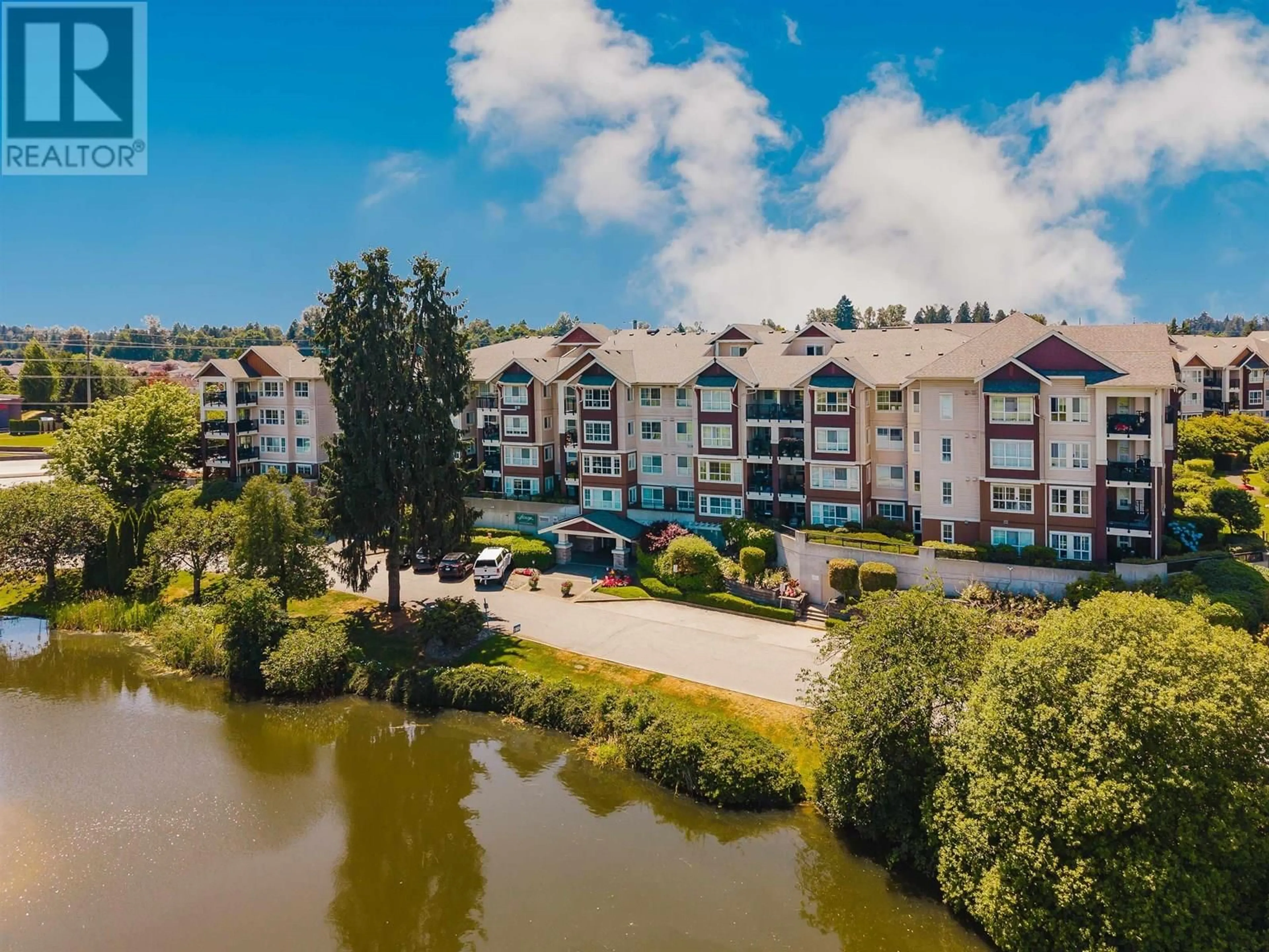 A pic from outside/outdoor area/front of a property/back of a property/a pic from drone, water/lake/river/ocean view for 205 - 19677 MEADOW GARDENS WAY, Pitt Meadows British Columbia V3Y0A2