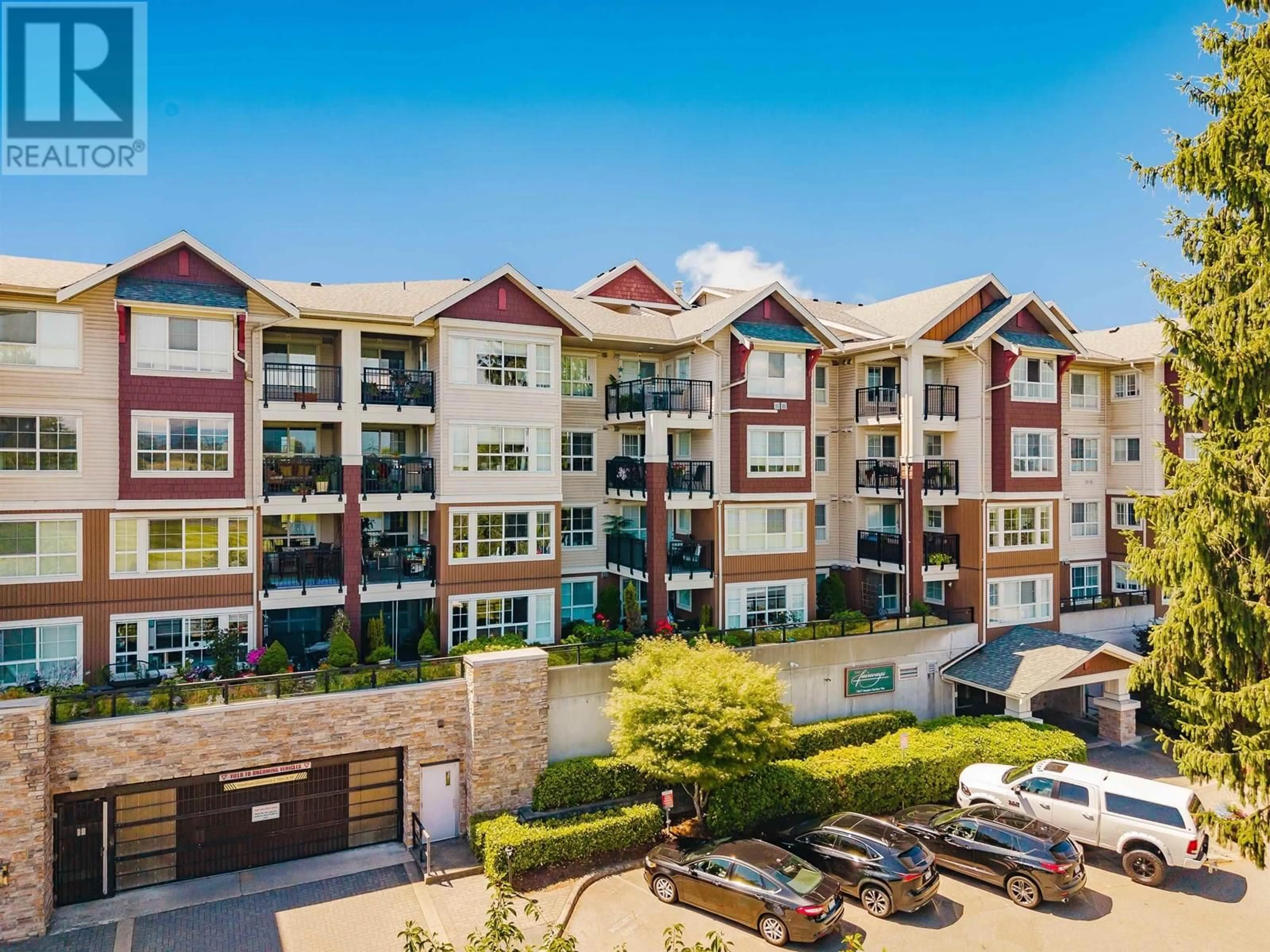 A pic from outside/outdoor area/front of a property/back of a property/a pic from drone, mountain view for 205 - 19677 MEADOW GARDENS WAY, Pitt Meadows British Columbia V3Y0A2