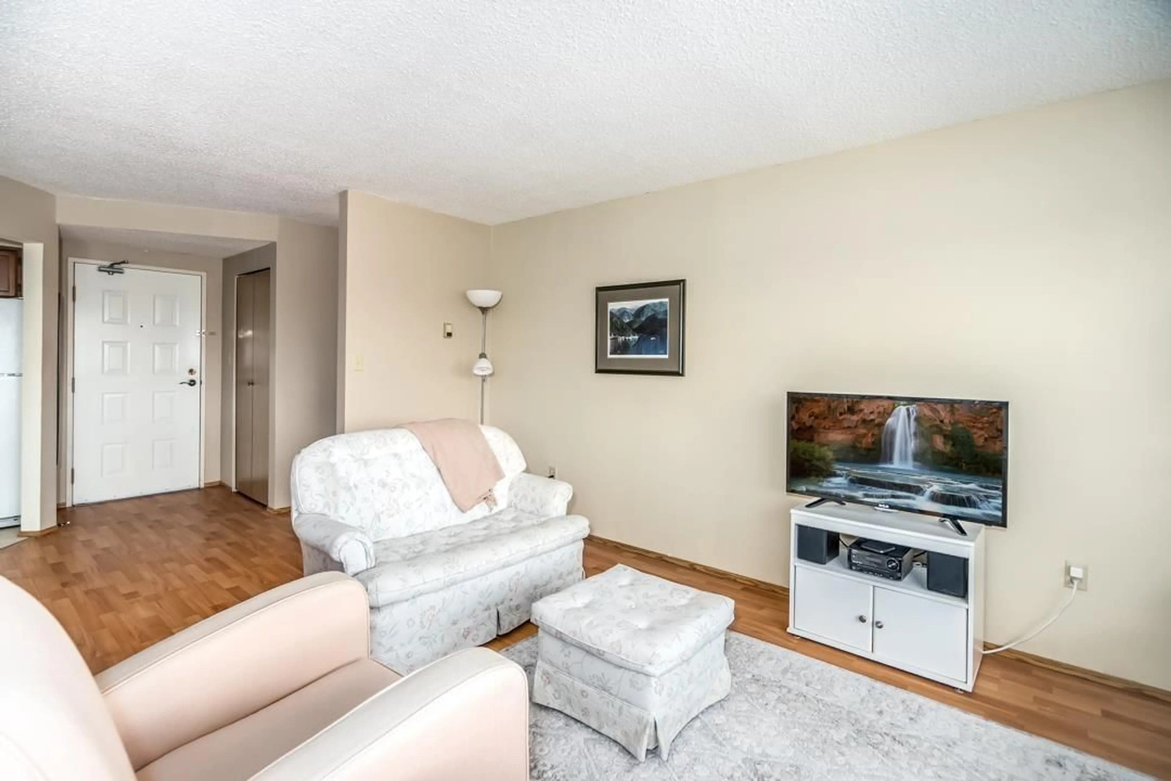Living room with furniture, wood/laminate floor for 604 - 31955 OLD YALE, Abbotsford British Columbia V2T4N1