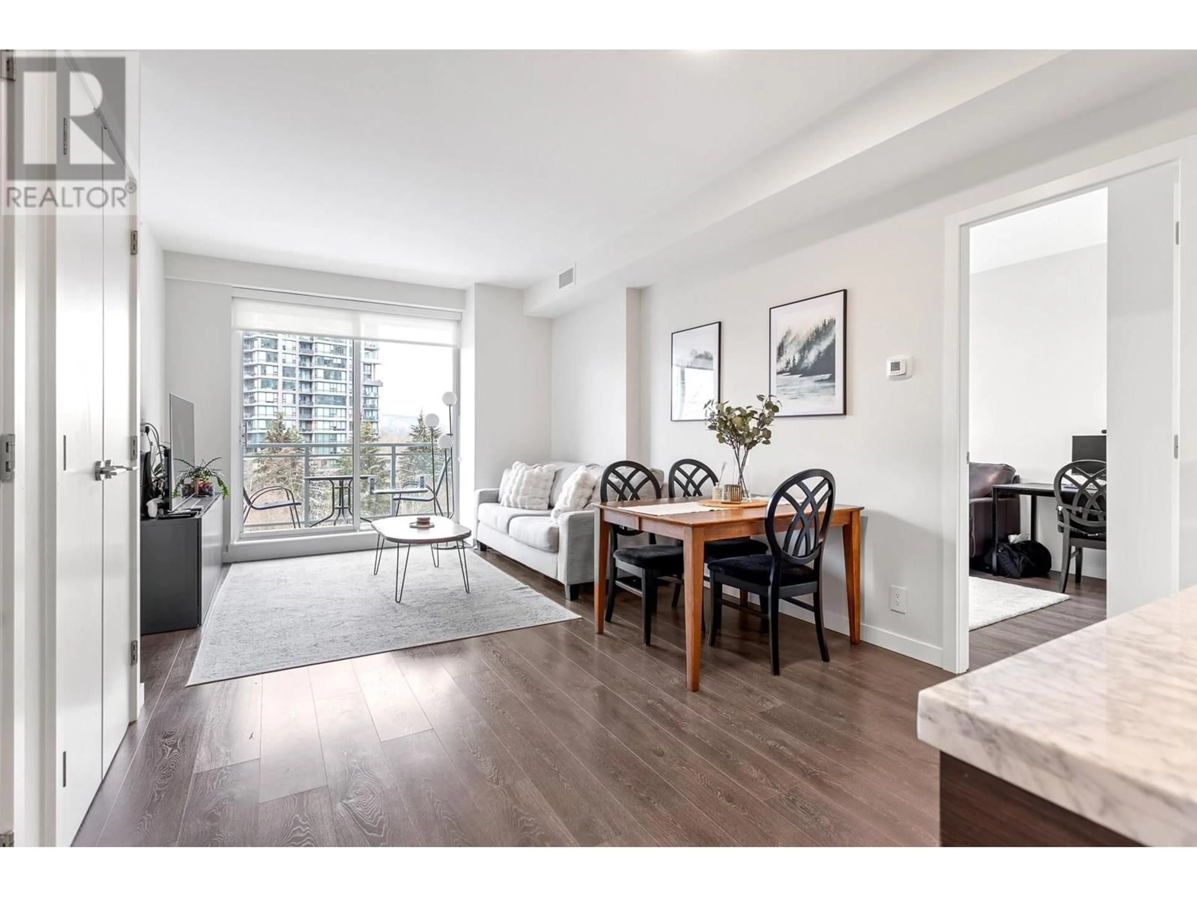 Living room with furniture, wood/laminate floor for 808 - 308 MORRISSEY ROAD, Port Moody British Columbia V3H0M2