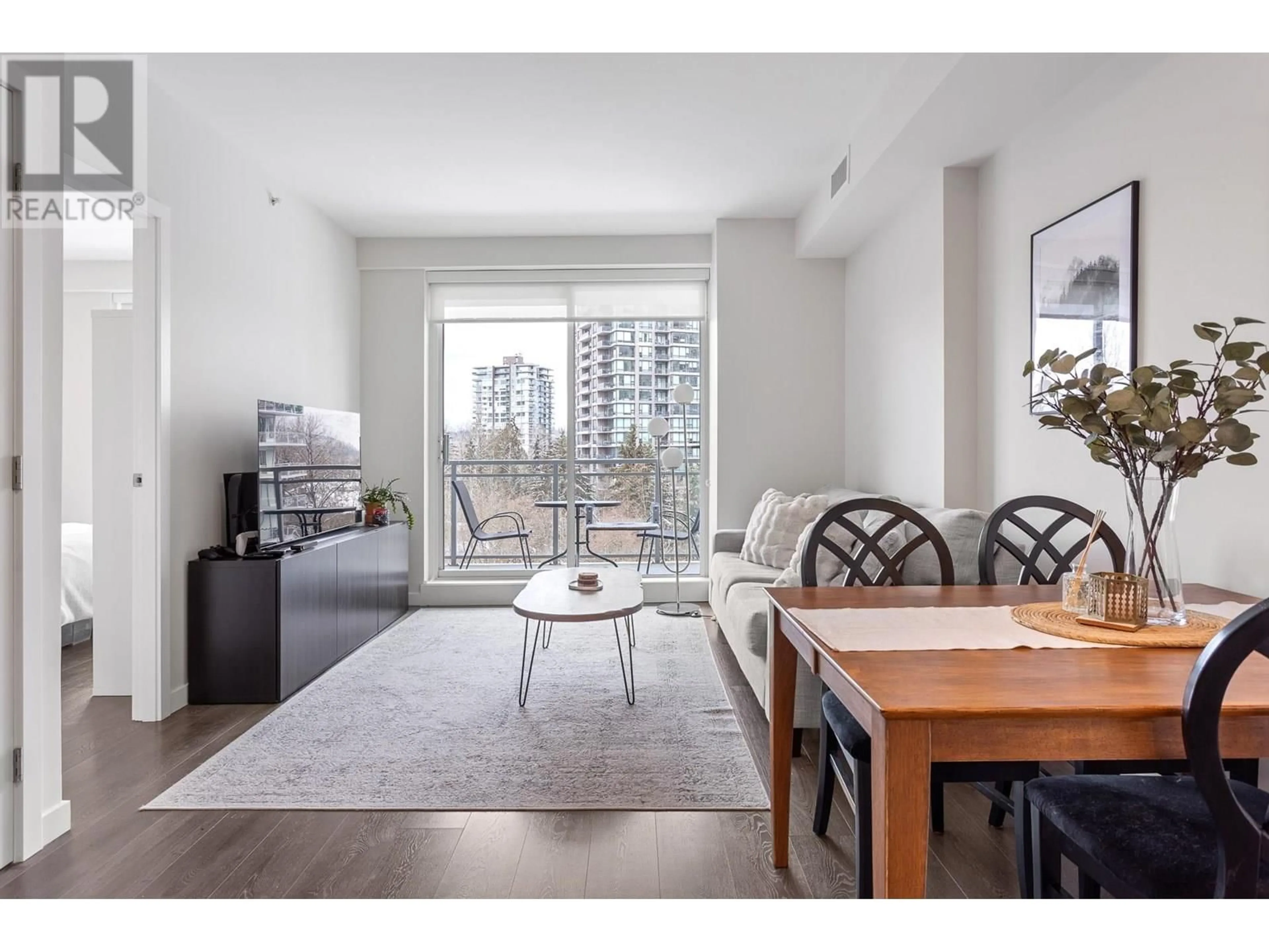Living room with furniture, wood/laminate floor for 808 - 308 MORRISSEY ROAD, Port Moody British Columbia V3H0M2