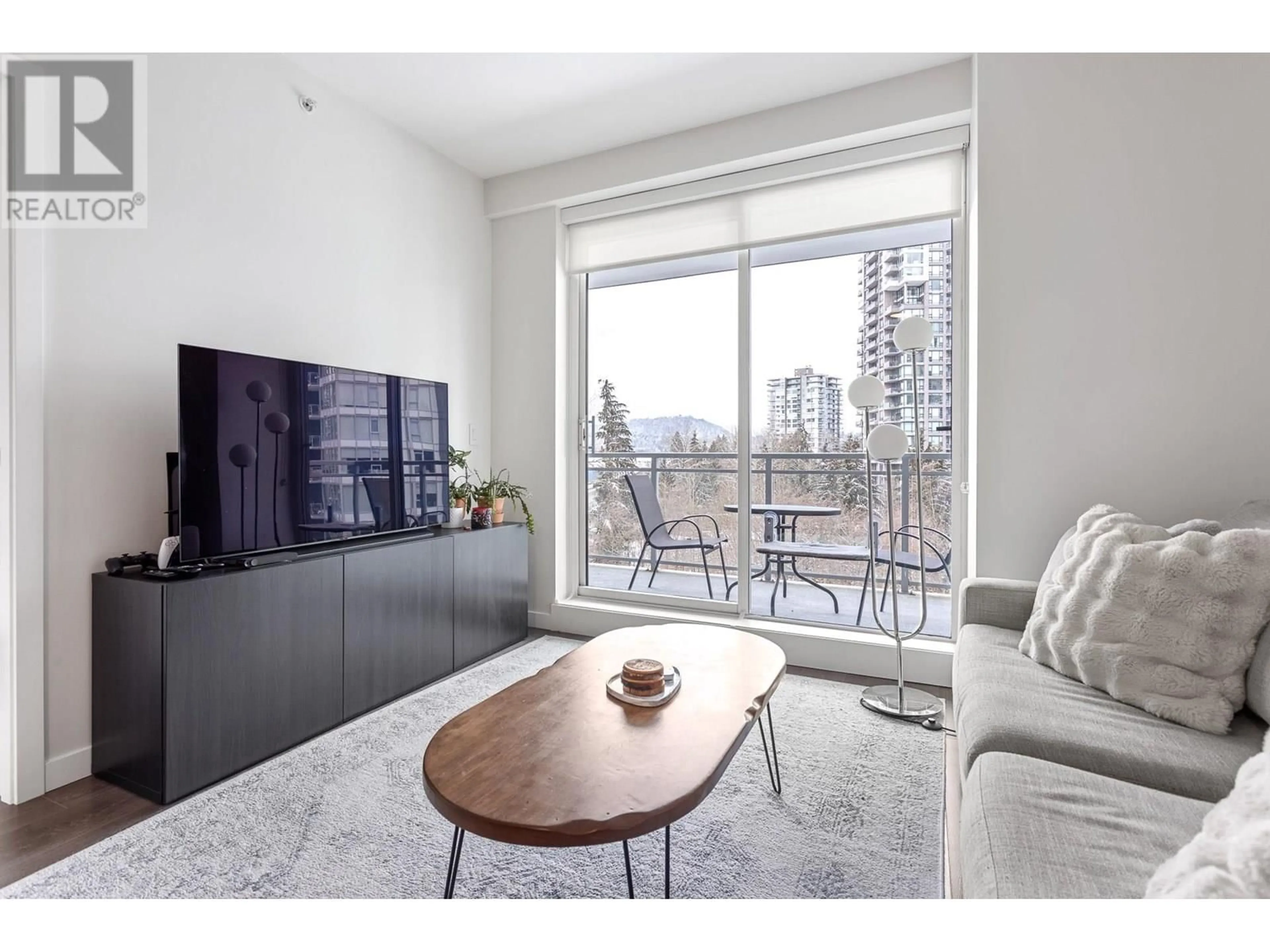 Living room with furniture, wood/laminate floor for 808 - 308 MORRISSEY ROAD, Port Moody British Columbia V3H0M2