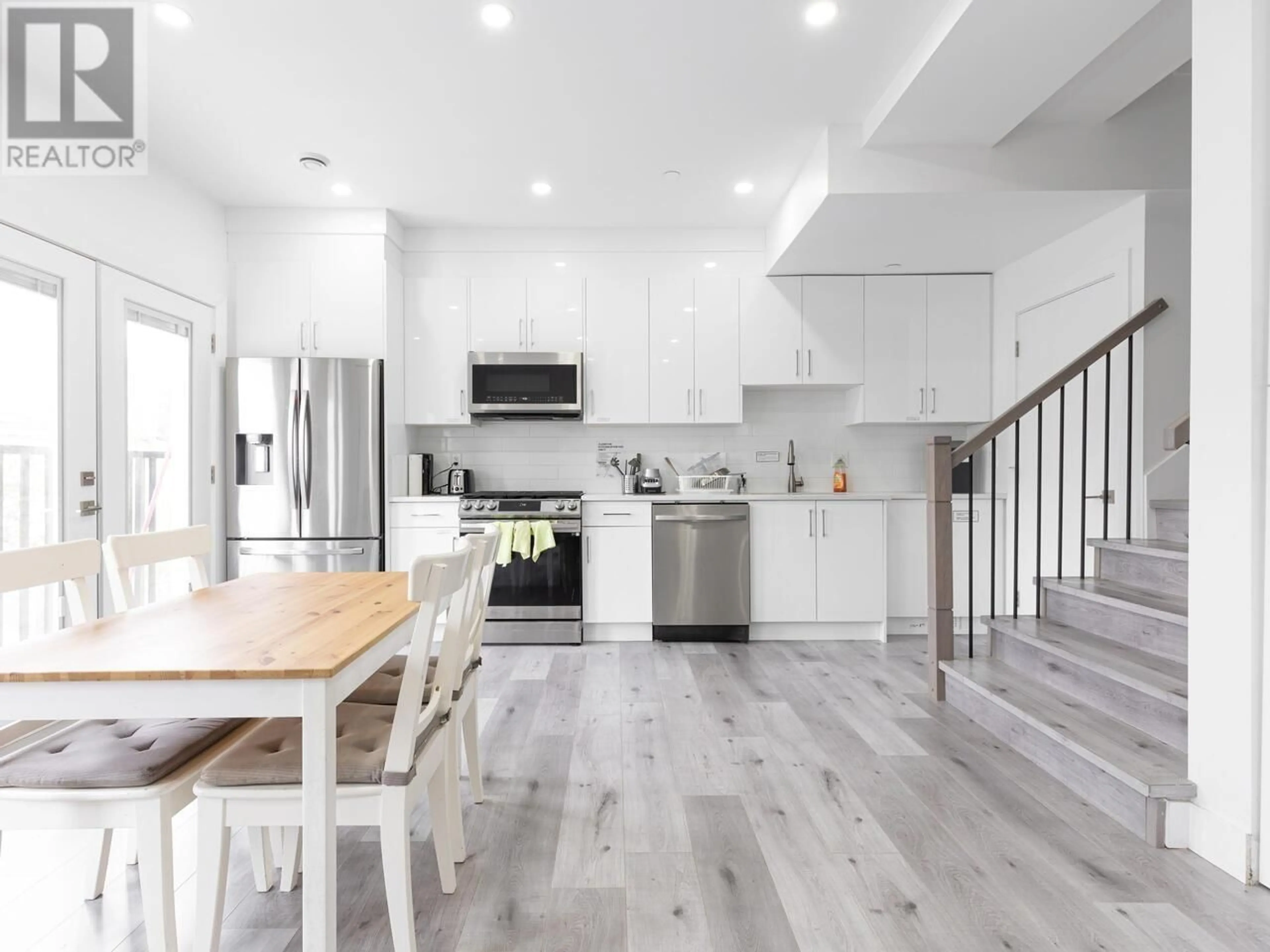 Open concept kitchen, wood/laminate floor for 5140 SLOCAN STREET, Vancouver British Columbia V5R2A5