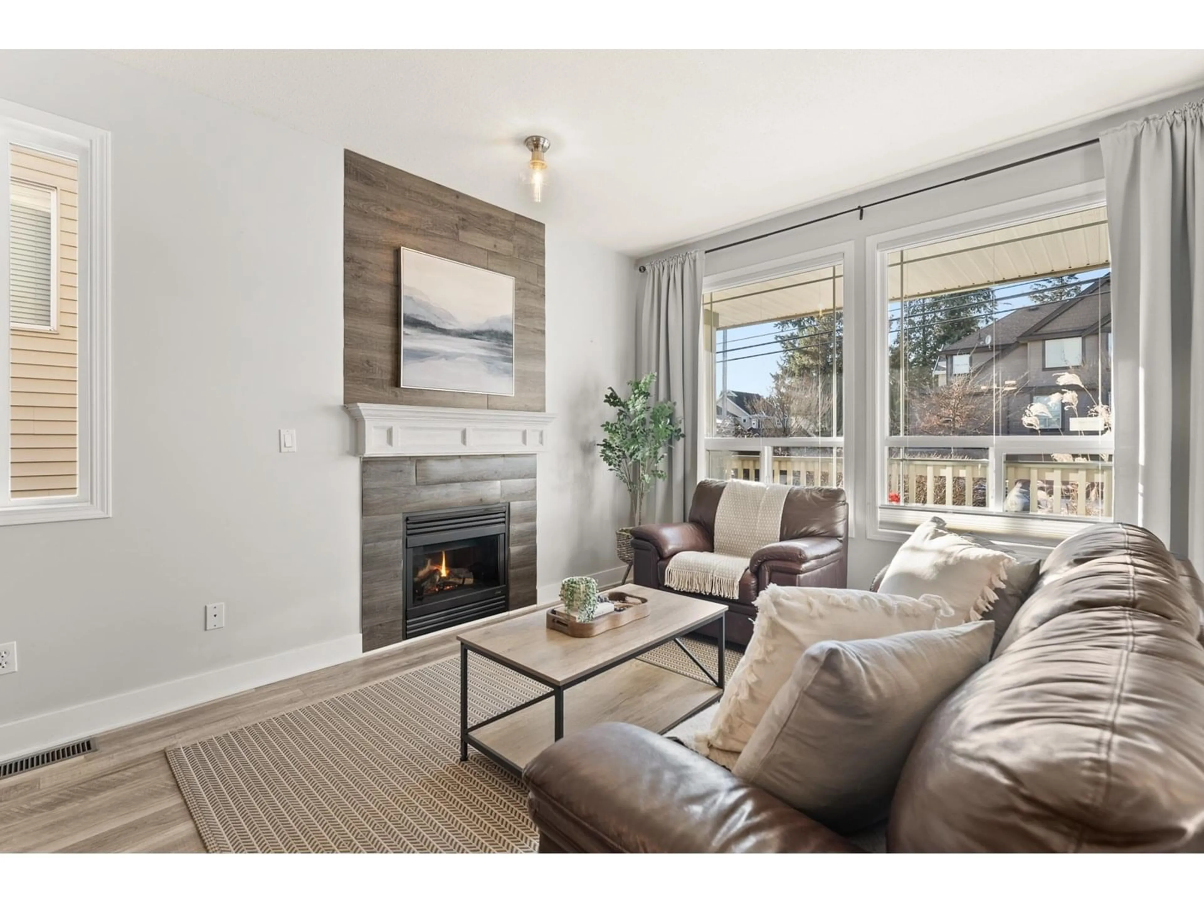 Living room with furniture, wood/laminate floor for 5736 148, Surrey British Columbia V3S3B6