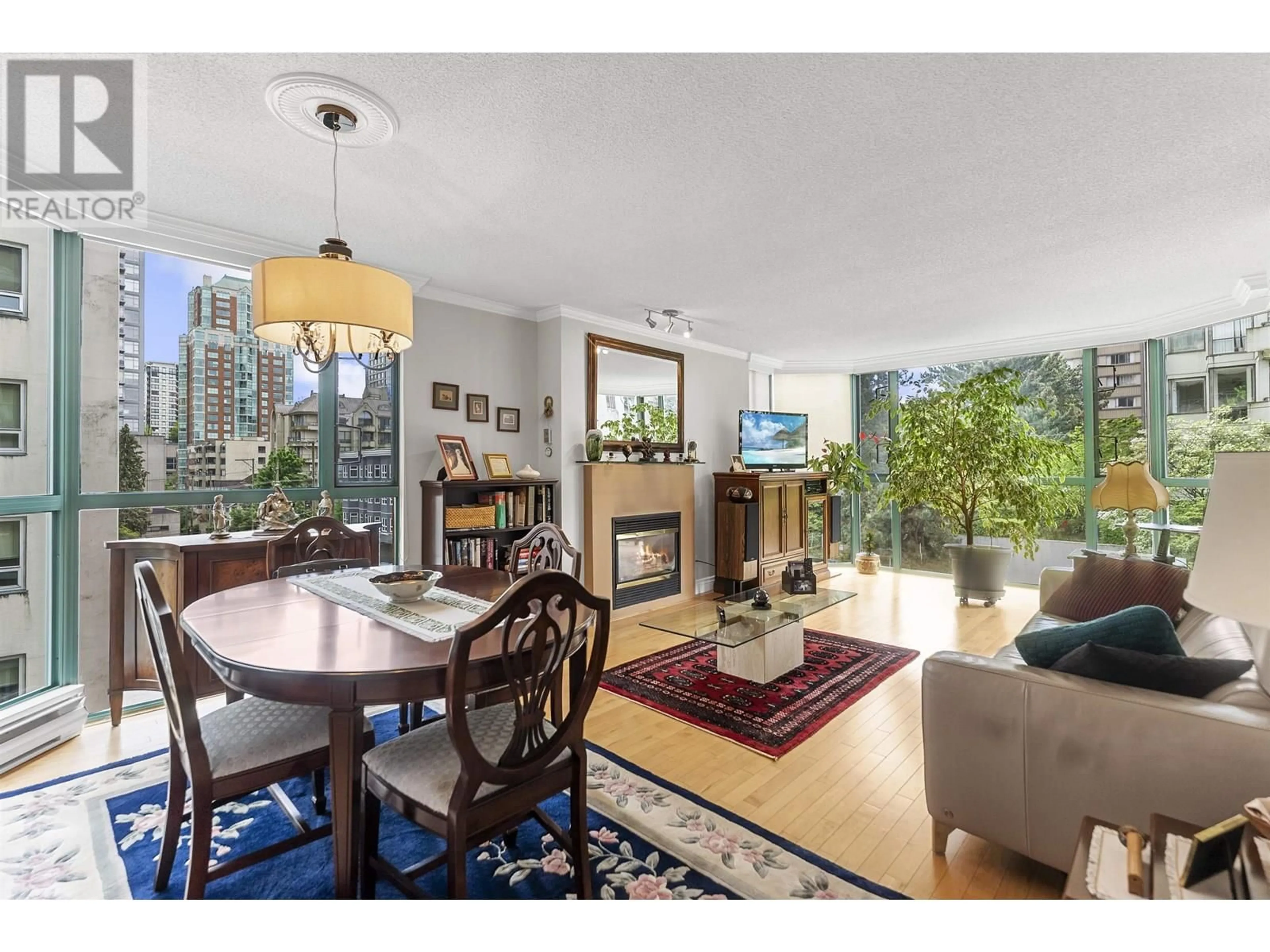 Living room with furniture, wood/laminate floor for 401 - 1132 HARO STREET, Vancouver British Columbia V6E1C9