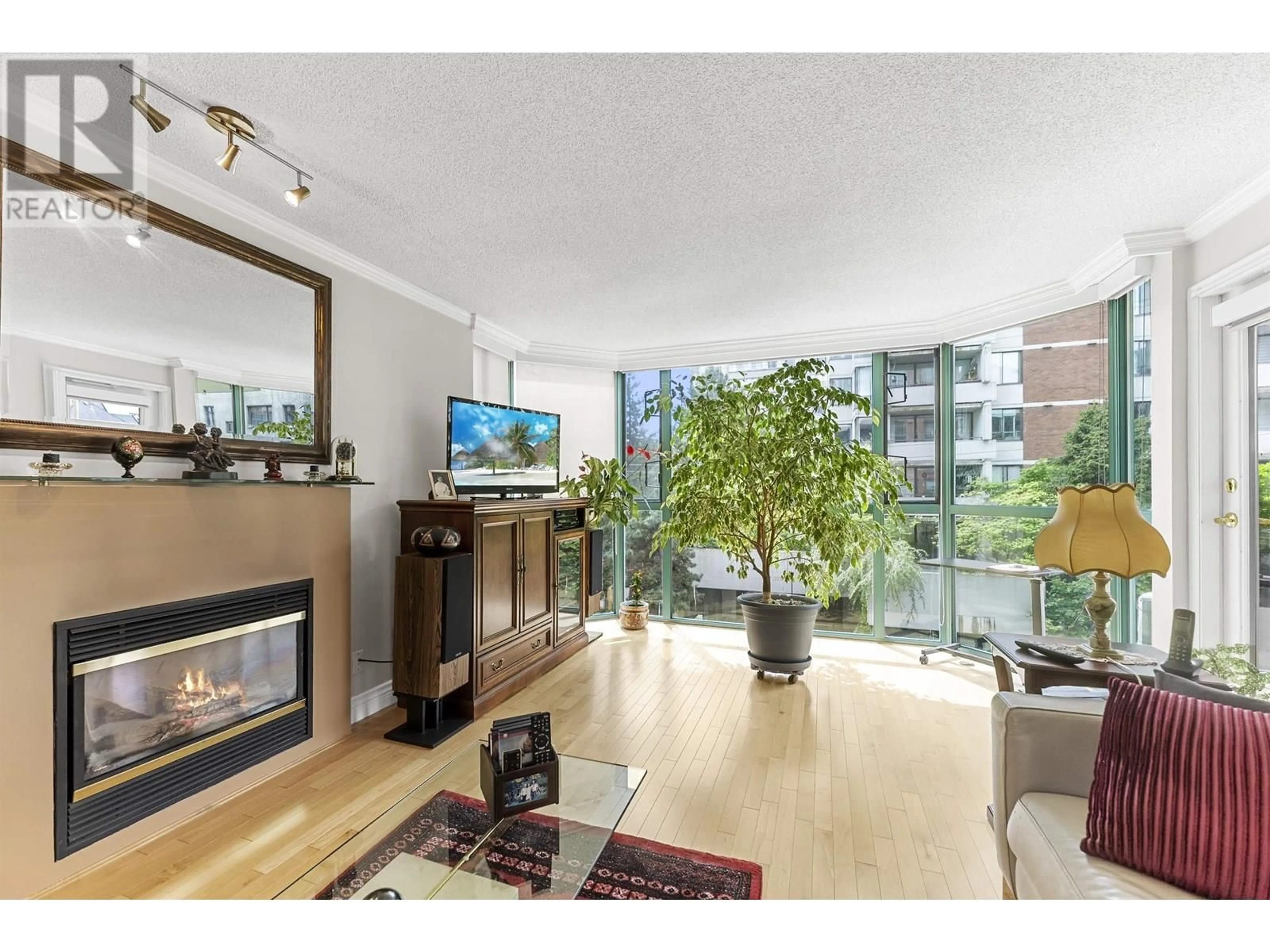 Living room with furniture, wood/laminate floor for 401 - 1132 HARO STREET, Vancouver British Columbia V6E1C9
