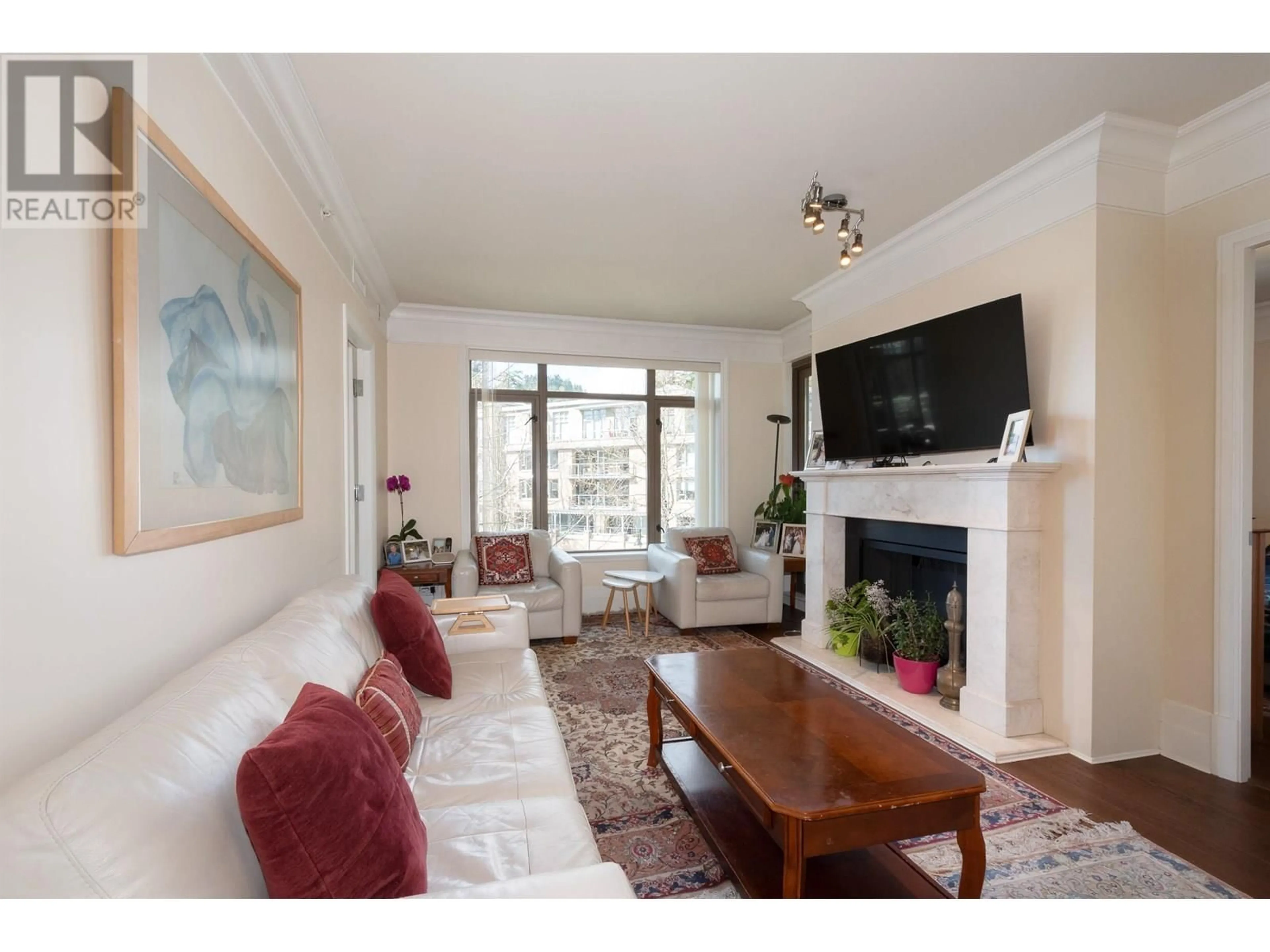Living room with furniture, wood/laminate floor for 300 - 533 WATERS EDGE CRESCENT, West Vancouver British Columbia V7T0A2