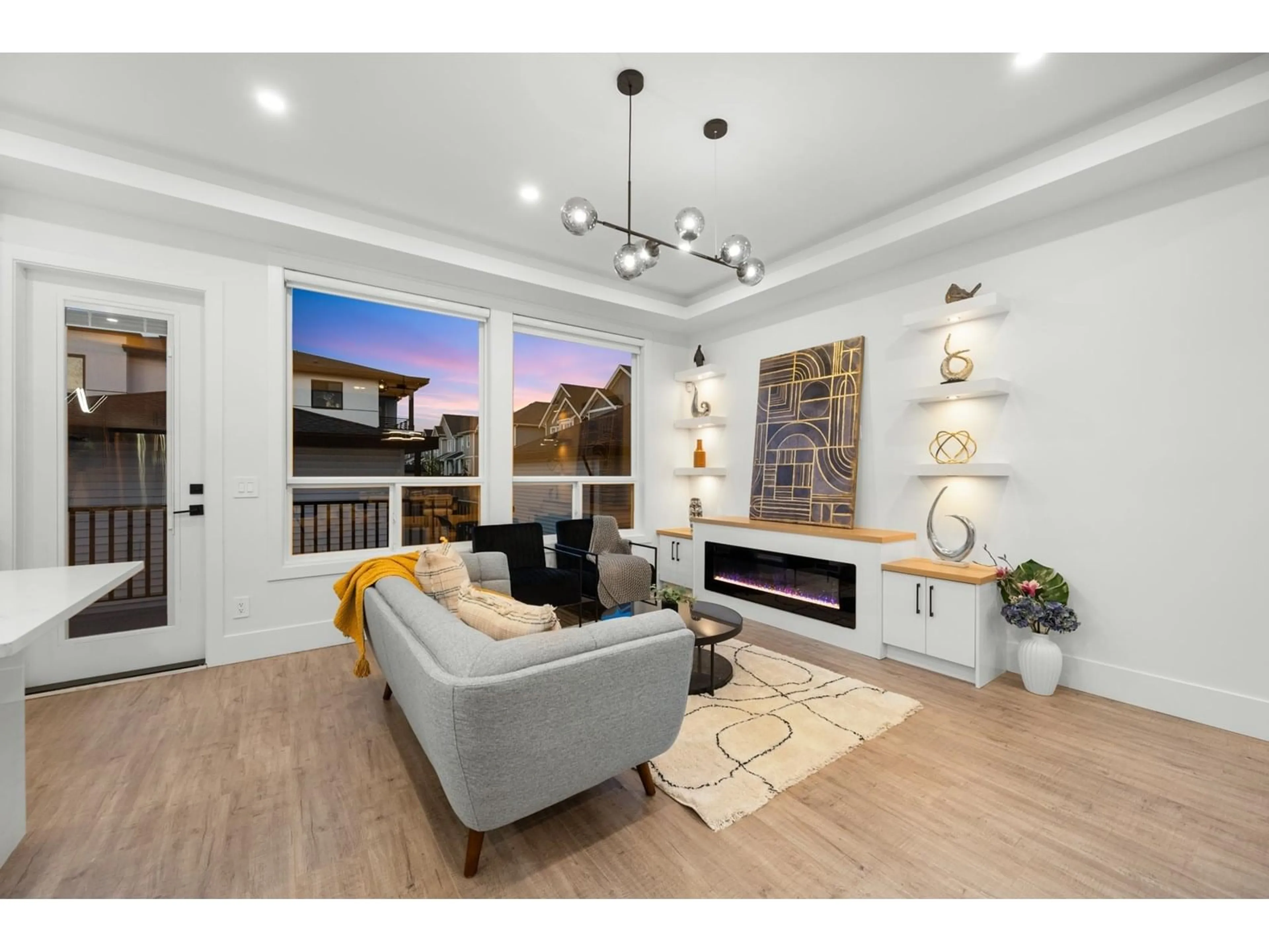 Living room with furniture, wood/laminate floor for 7652 206, Langley British Columbia V2Y3P6