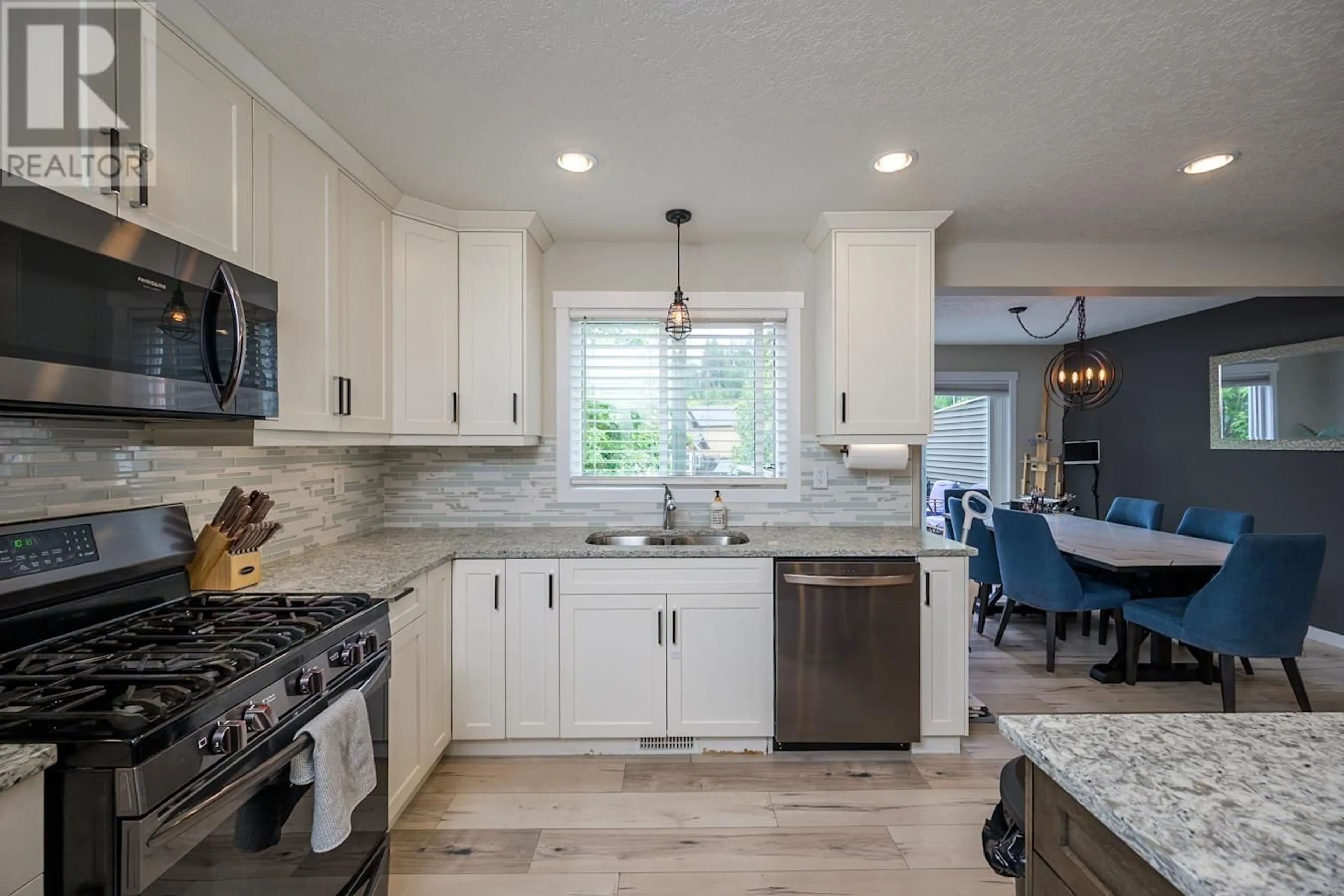 Open concept kitchen, ceramic/tile floor for 7677 CREEKSIDE WAY, Prince George British Columbia V2N0C2