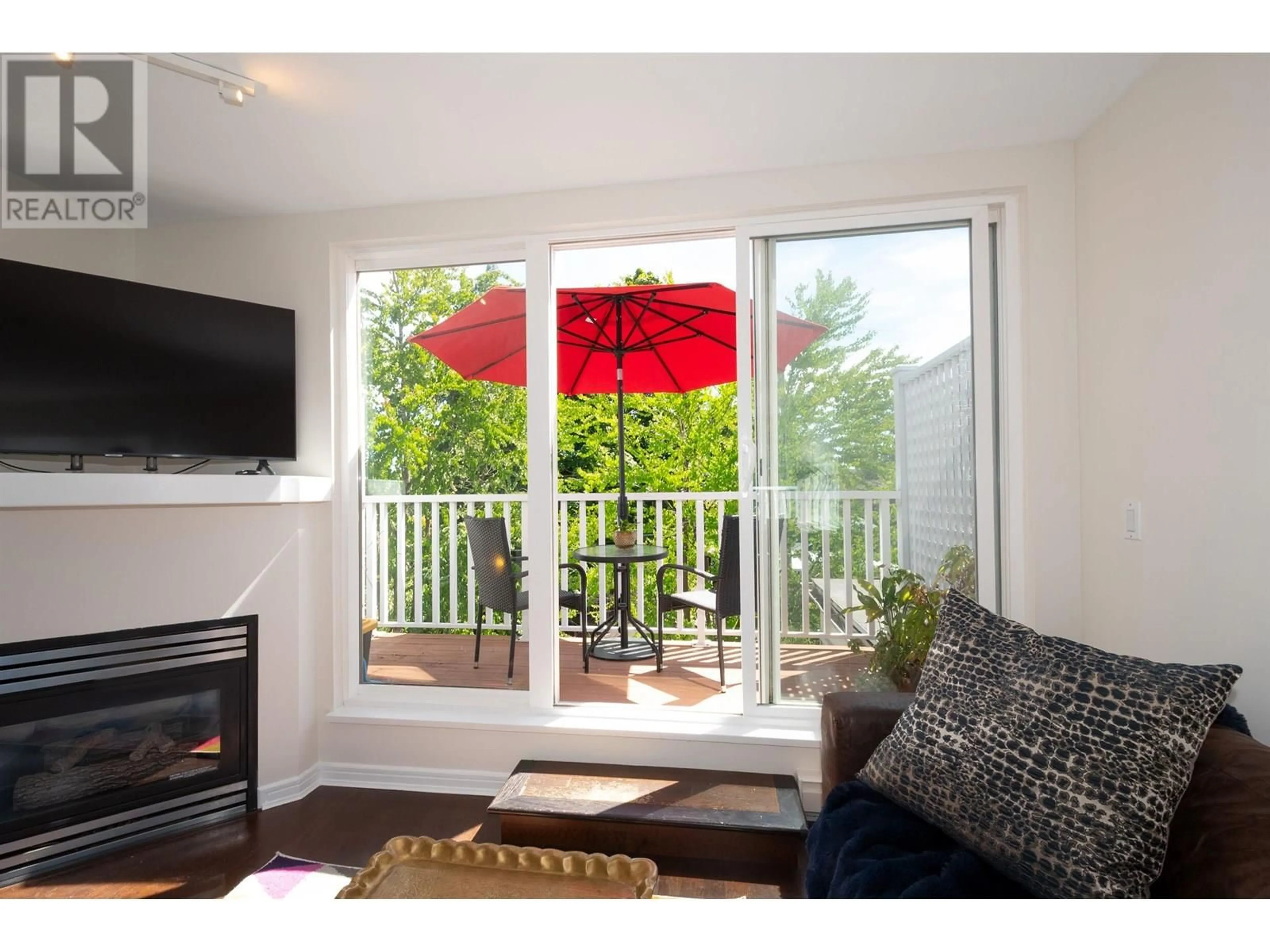Living room with furniture, wood/laminate floor for 314 - 3150 4TH AVENUE, Vancouver British Columbia V6K1R7