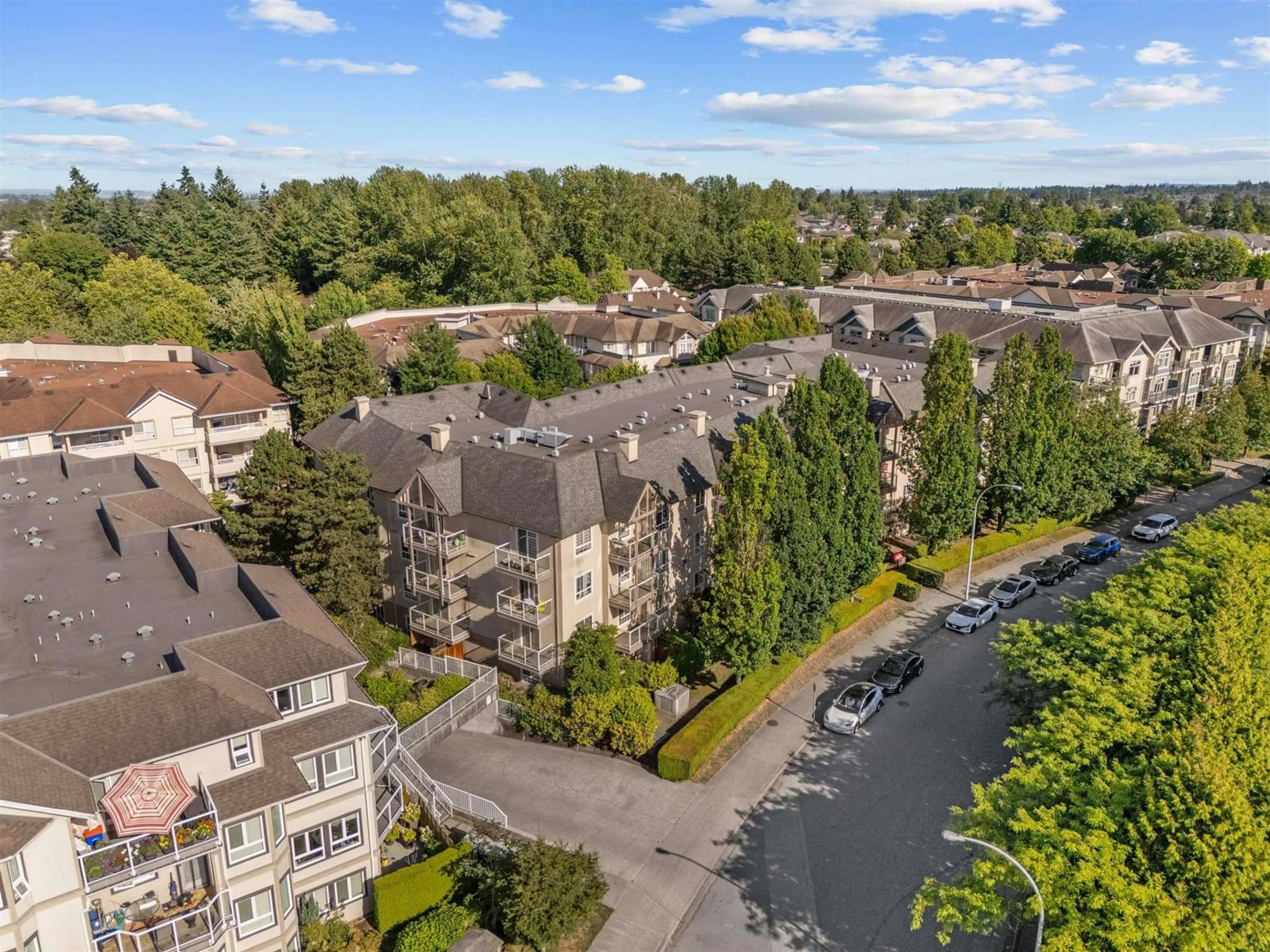 A pic from outside/outdoor area/front of a property/back of a property/a pic from drone, city buildings view from balcony for 312 - 8110 120A, Surrey British Columbia V3W3P3