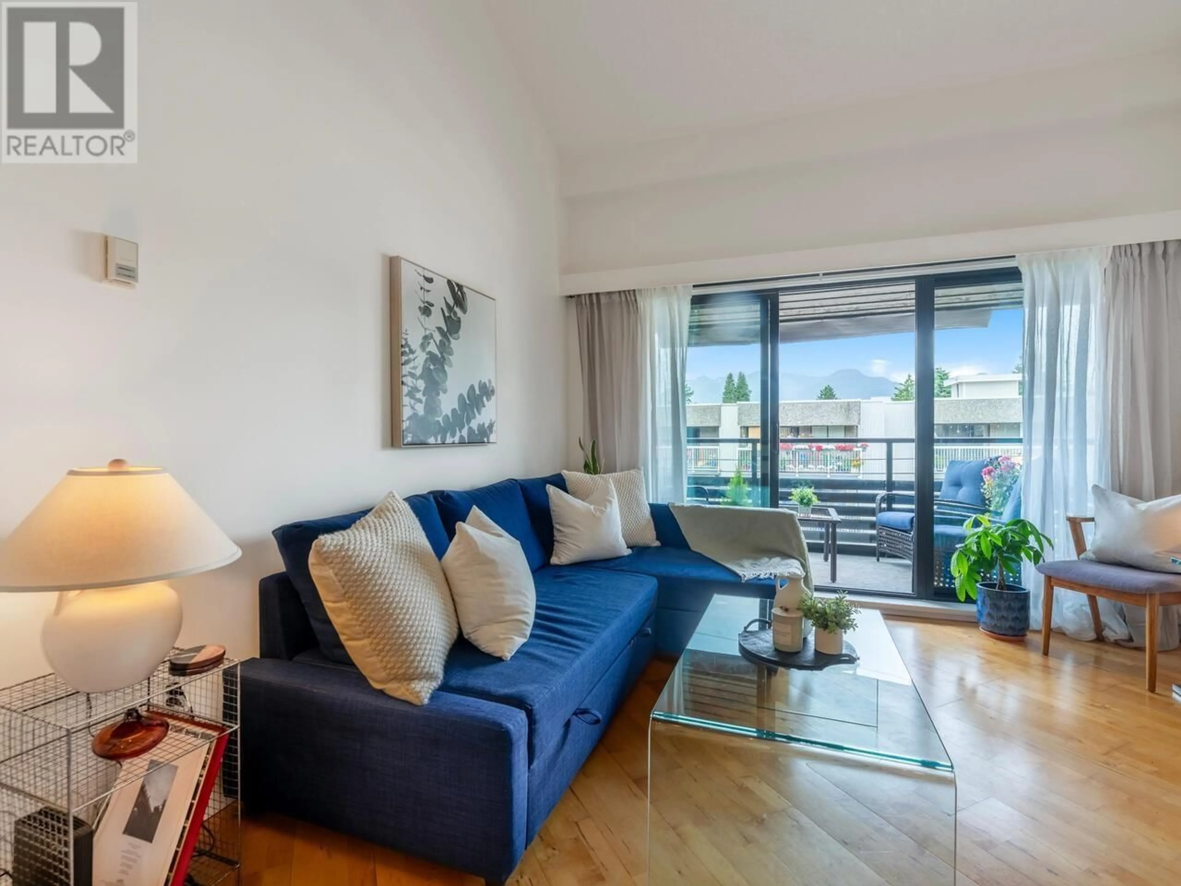 Living room with furniture, wood/laminate floor for 408 - 1549 KITCHENER STREET, Vancouver British Columbia V5L2V8