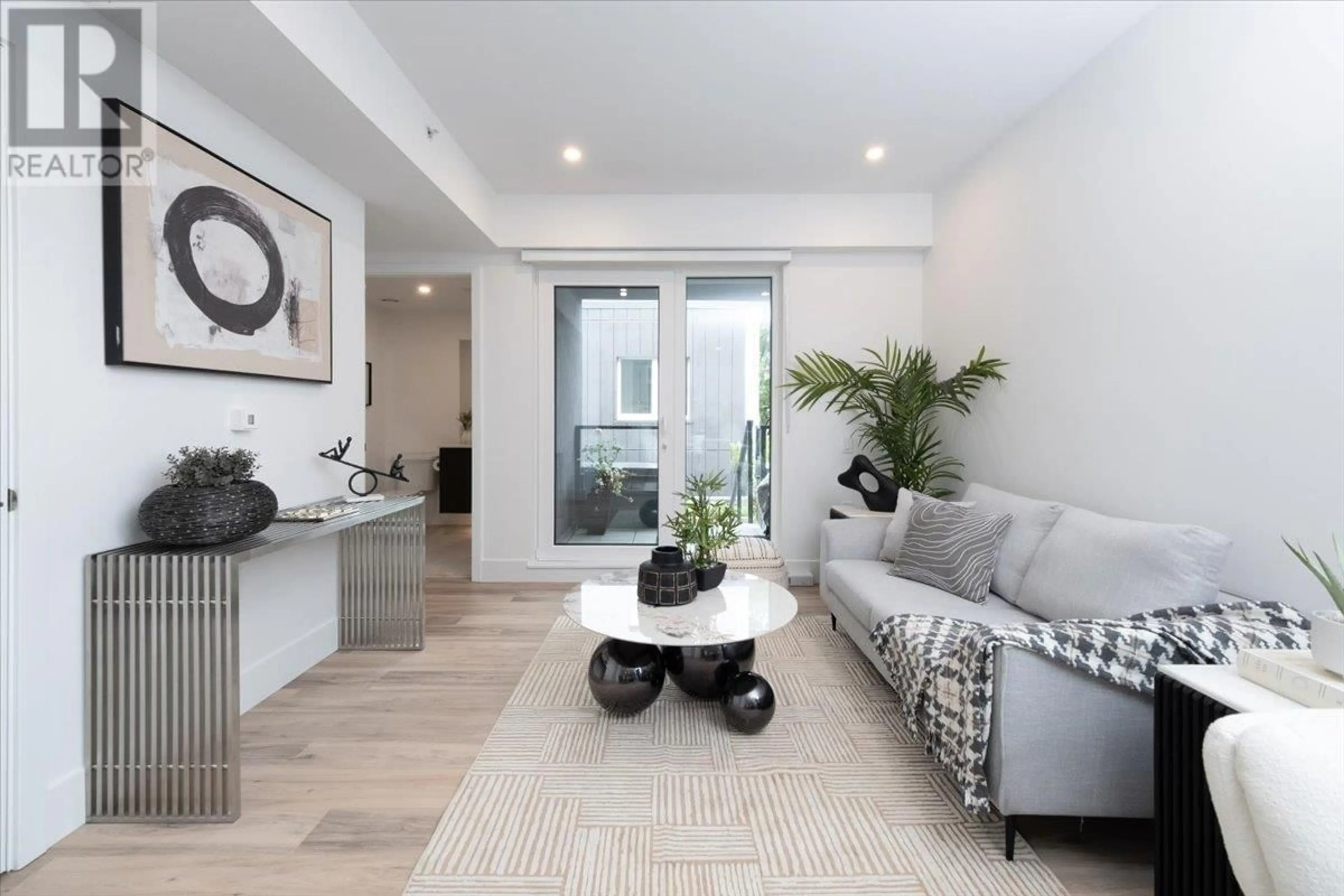 Living room with furniture, unknown for 205 - 2075 1ST AVENUE, Vancouver British Columbia V5N1B6