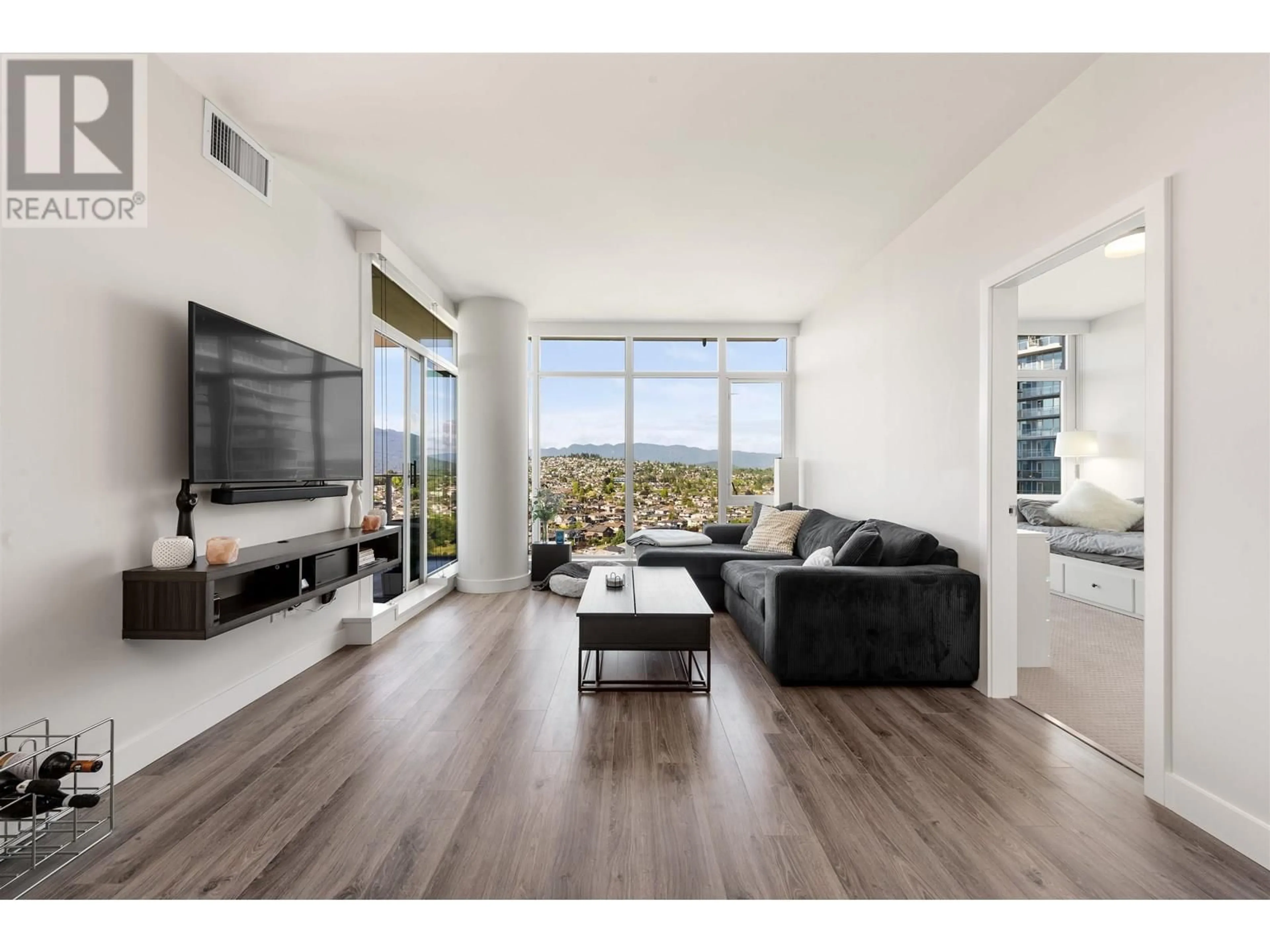 Living room with furniture, wood/laminate floor for 2408 - 1788 GILMORE AVENUE, Burnaby British Columbia V5C0L5