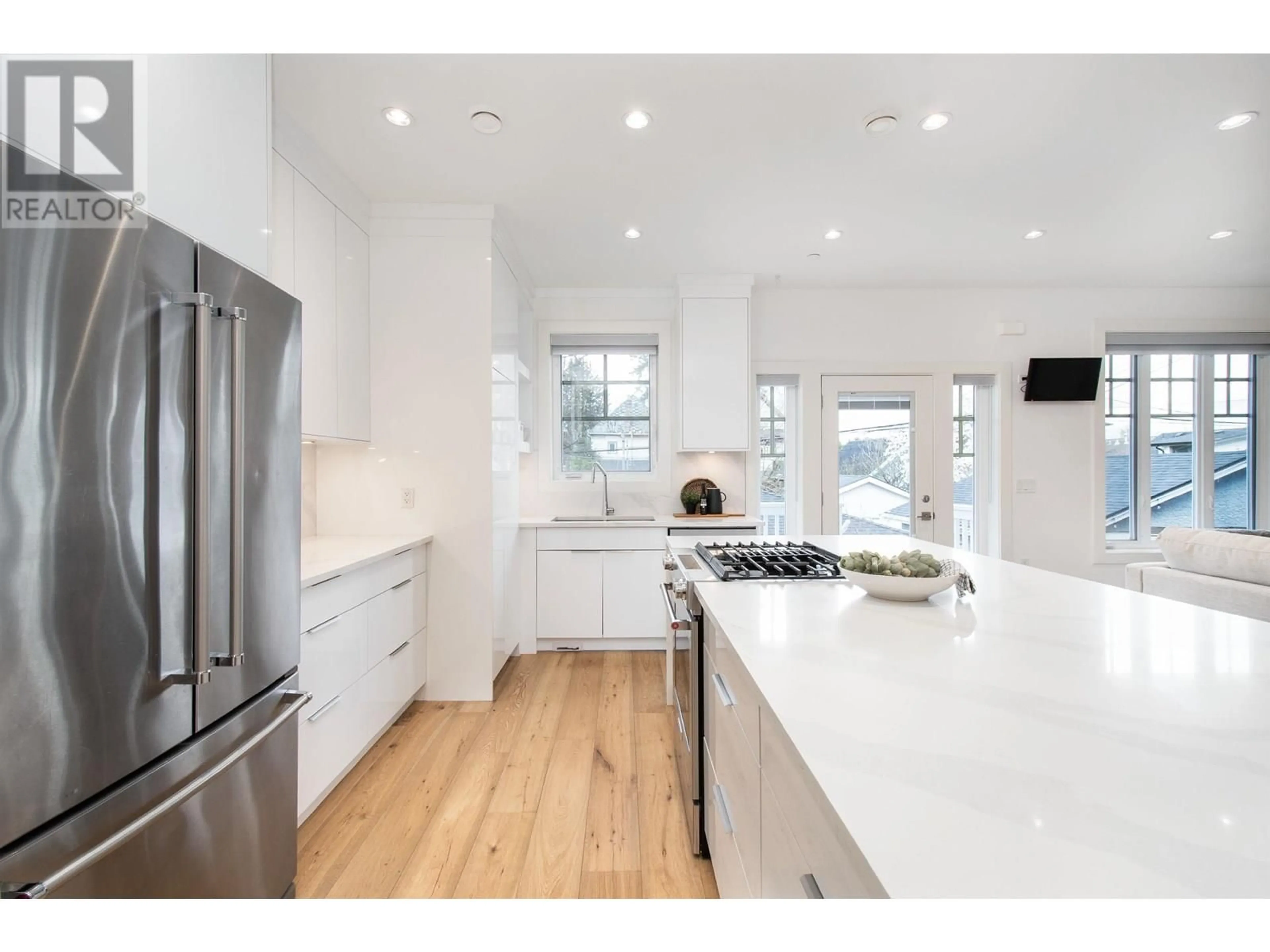Open concept kitchen, wood/laminate floor for 849 13TH AVENUE, Vancouver British Columbia V5T2L4