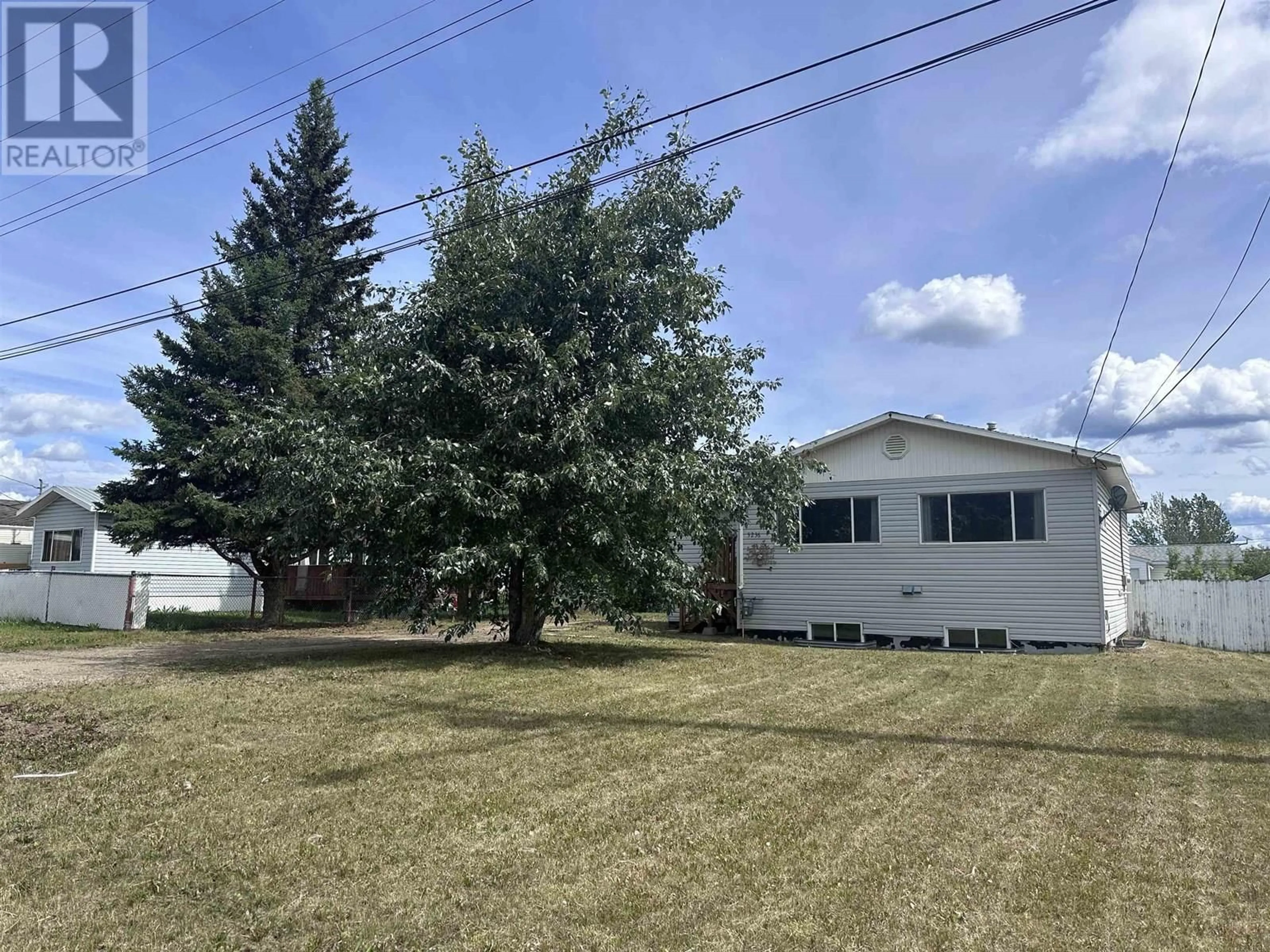 A pic from outside/outdoor area/front of a property/back of a property/a pic from drone, street for 5236 42 STREET, Fort Nelson British Columbia V0C1R0