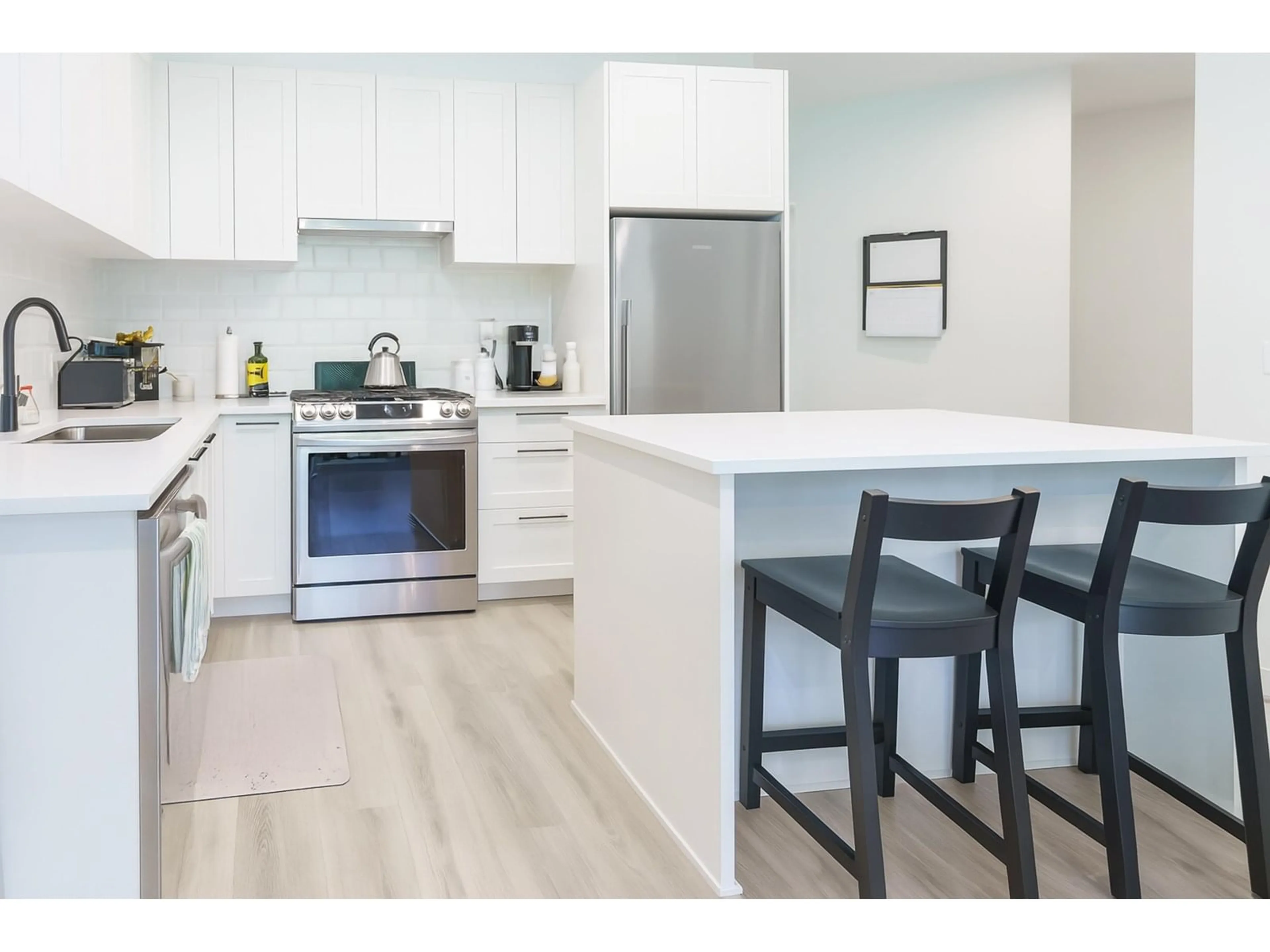 Open concept kitchen, wood/laminate floor for 119 - 5415 BRYDON, Langley British Columbia V3A0N4
