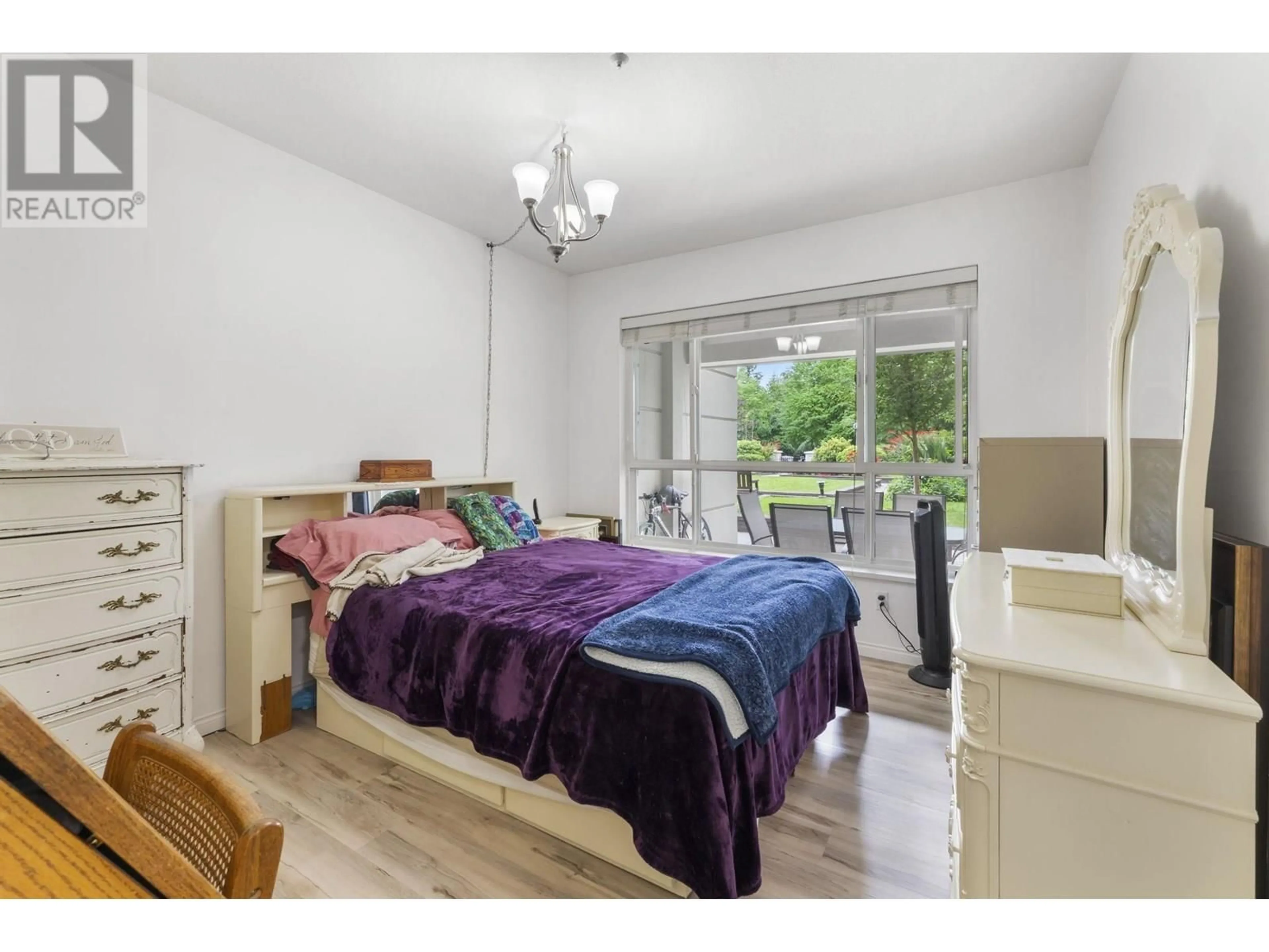 Bedroom with bed, wood/laminate floor for 121 - 3098 GUILDFORD WAY, Coquitlam British Columbia V3B7W8