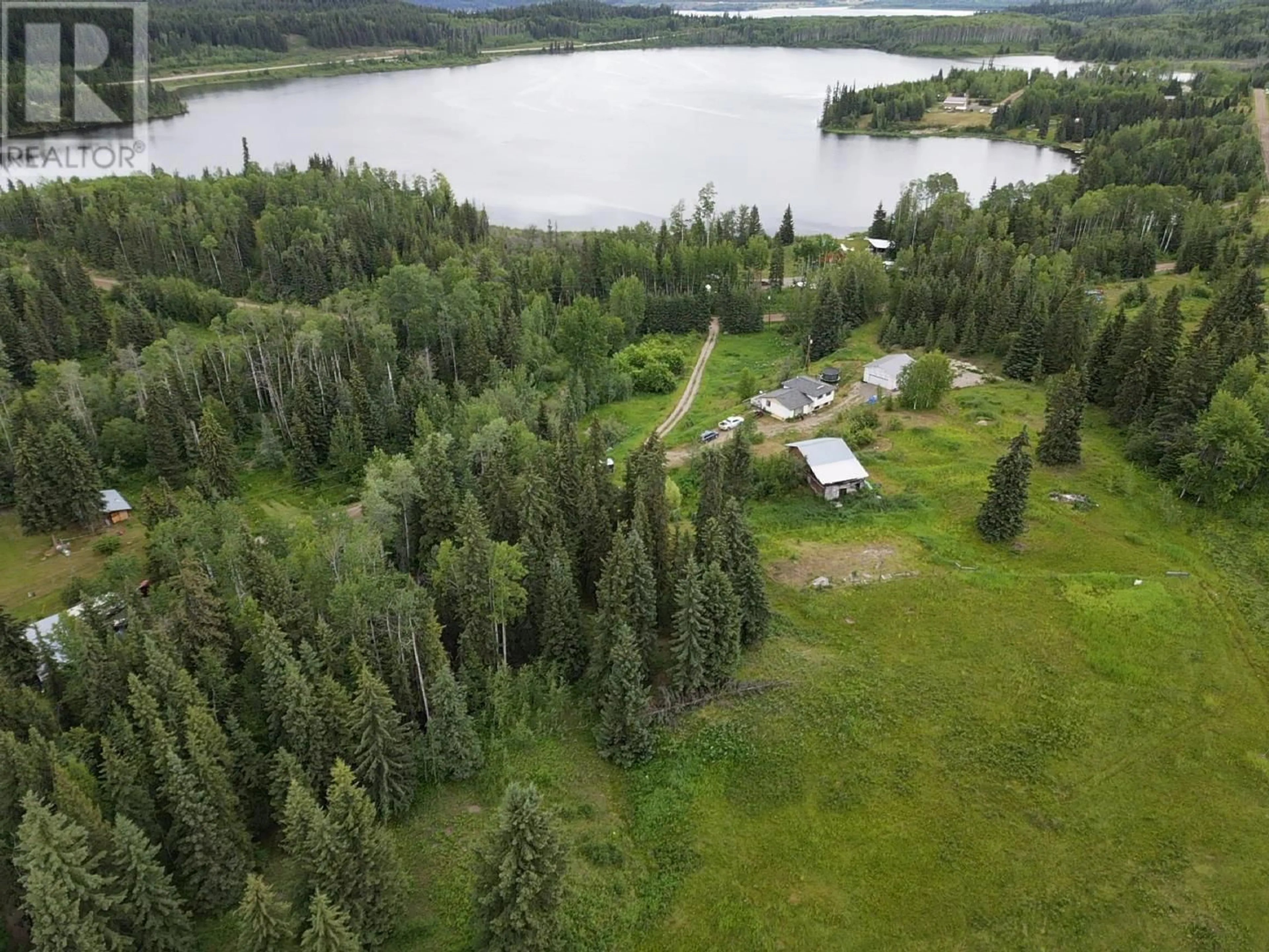 A pic from outside/outdoor area/front of a property/back of a property/a pic from drone, water/lake/river/ocean view for 10897 BAYVIEW ROAD, Fraser Lake British Columbia V0J1S0