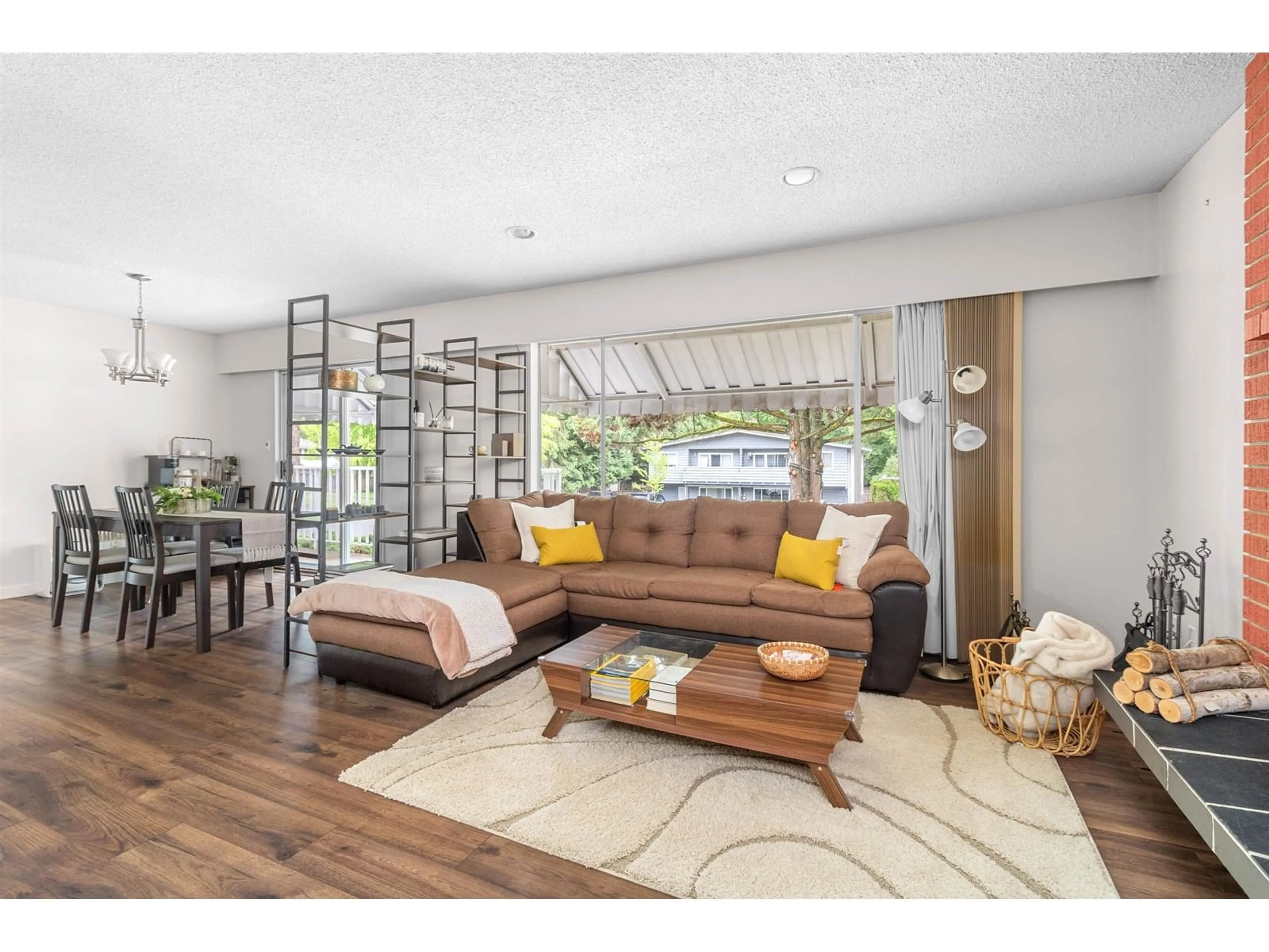 Living room with furniture, wood/laminate floor for 10232 142A, Surrey British Columbia V3T4Z7