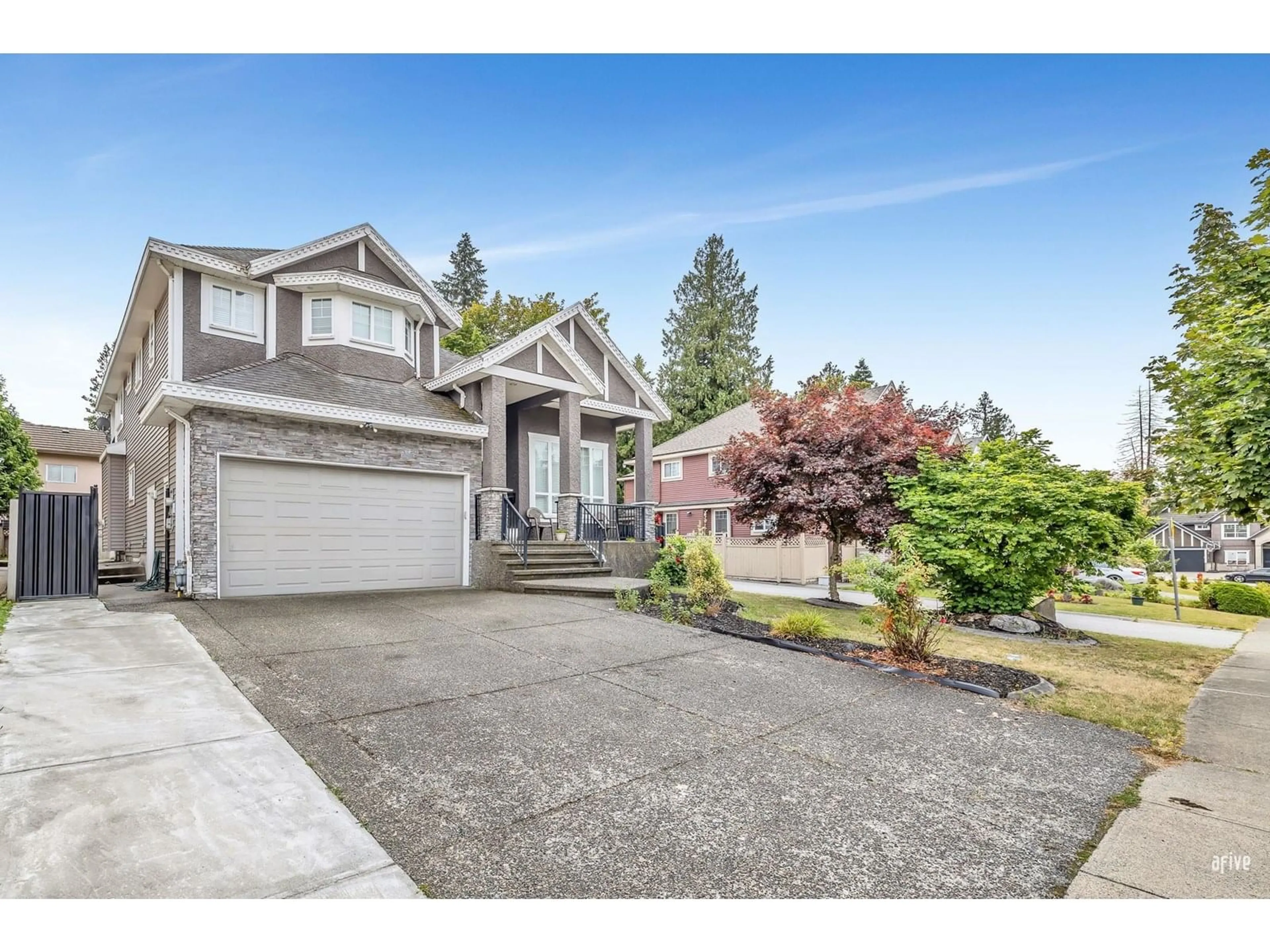 Home with vinyl exterior material, street for 12788 105A, Surrey British Columbia V3V0A6