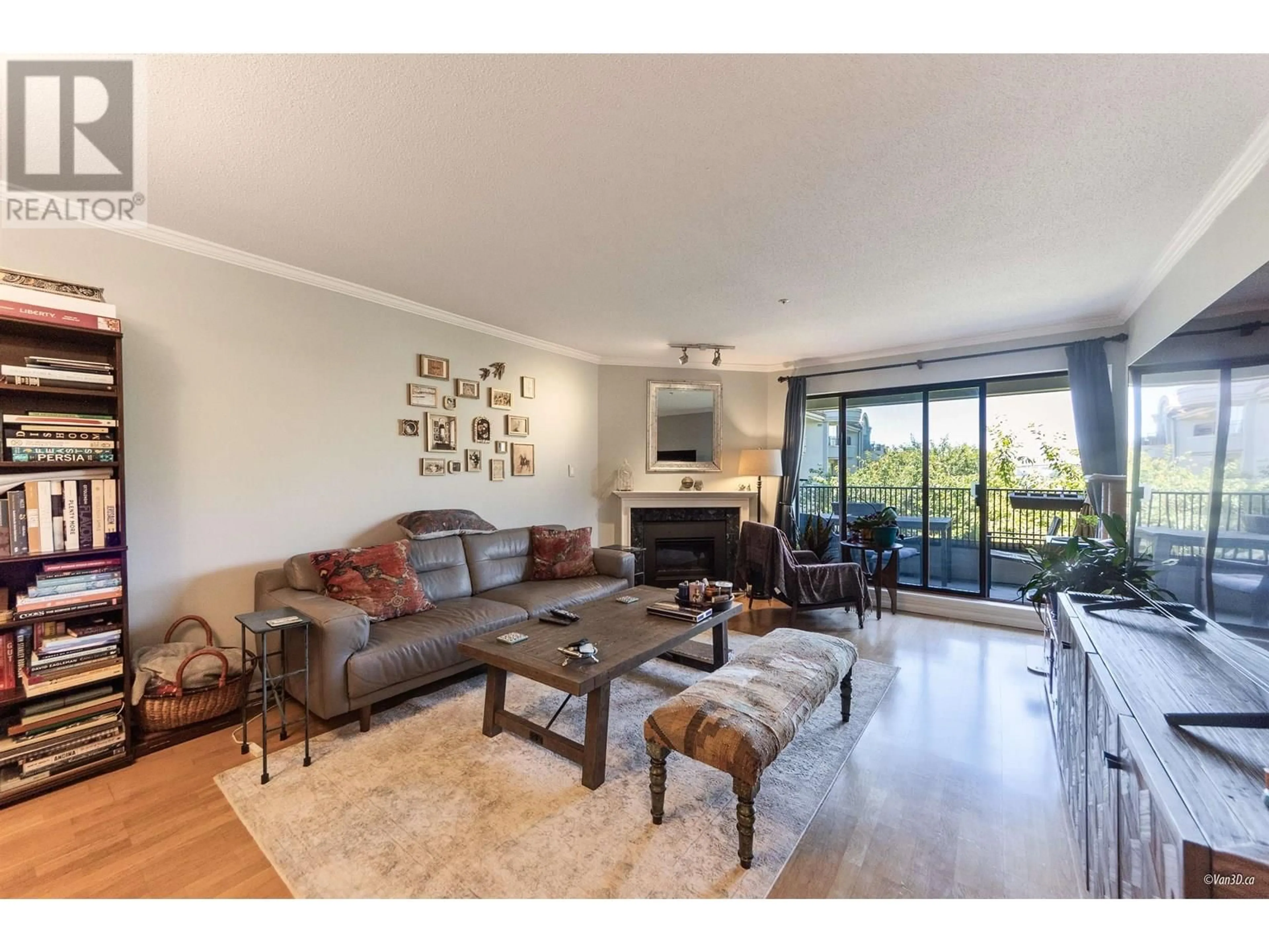 Living room with furniture, wood/laminate floor for 302 - 1869 SPYGLASS PLACE, Vancouver British Columbia V5Z4K7