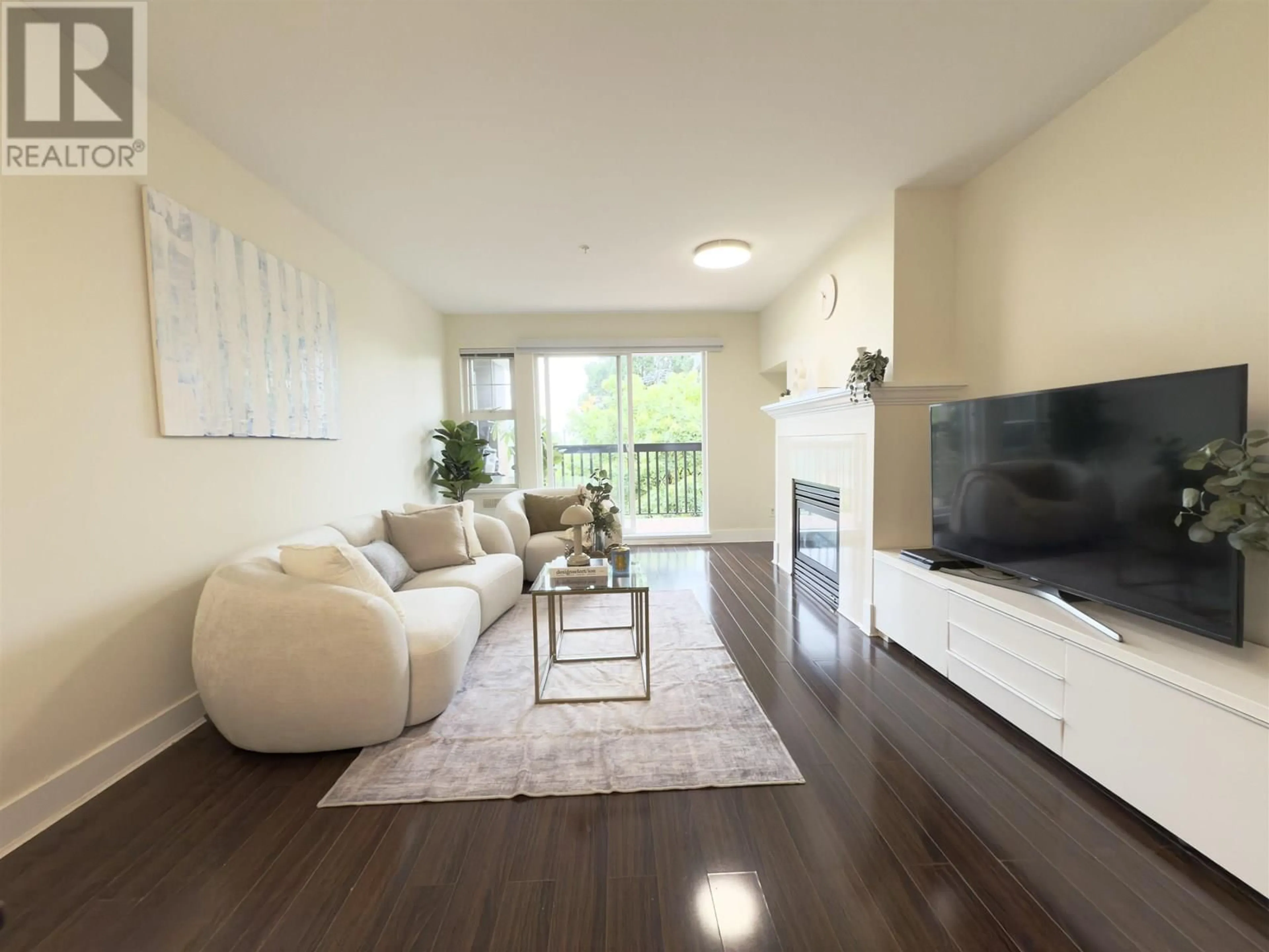 Living room with furniture, wood/laminate floor for 312 - 995 59TH AVENUE, Vancouver British Columbia V6P6Z2