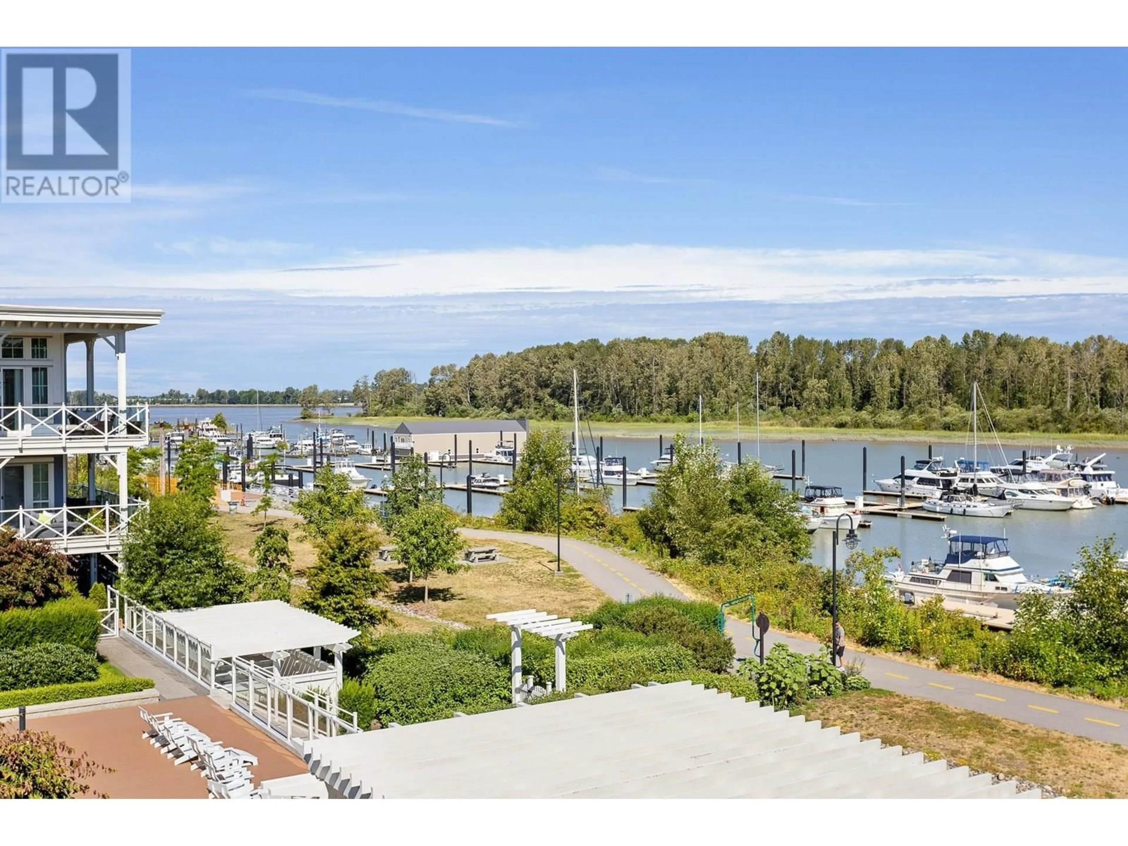 A pic from outside/outdoor area/front of a property/back of a property/a pic from drone, water/lake/river/ocean view for 317 - 5535 ADMIRAL WAY, Delta British Columbia V4K0E3