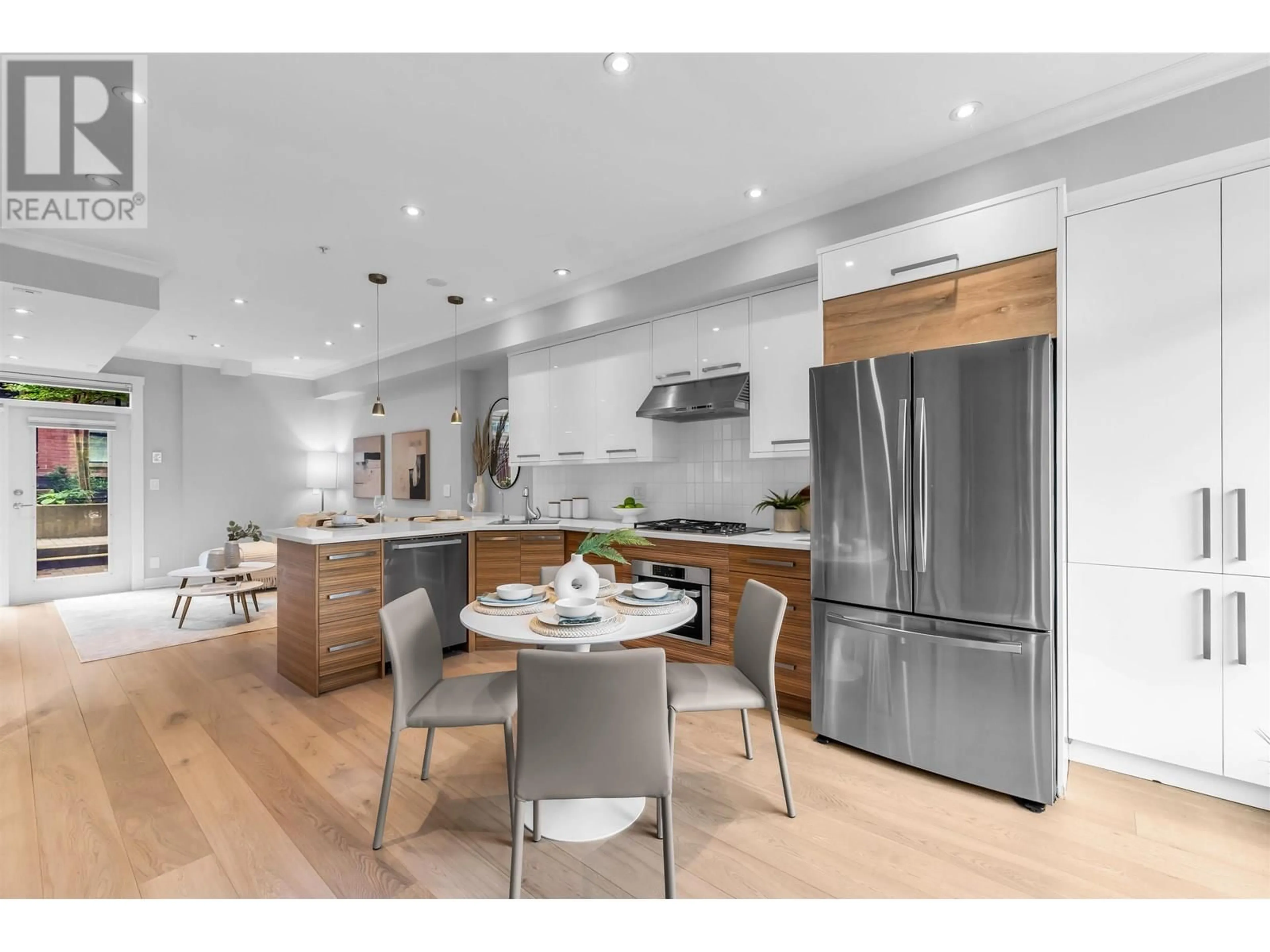 Open concept kitchen, wood/laminate floor for 1956 5TH AVENUE, Vancouver British Columbia V6J1P7