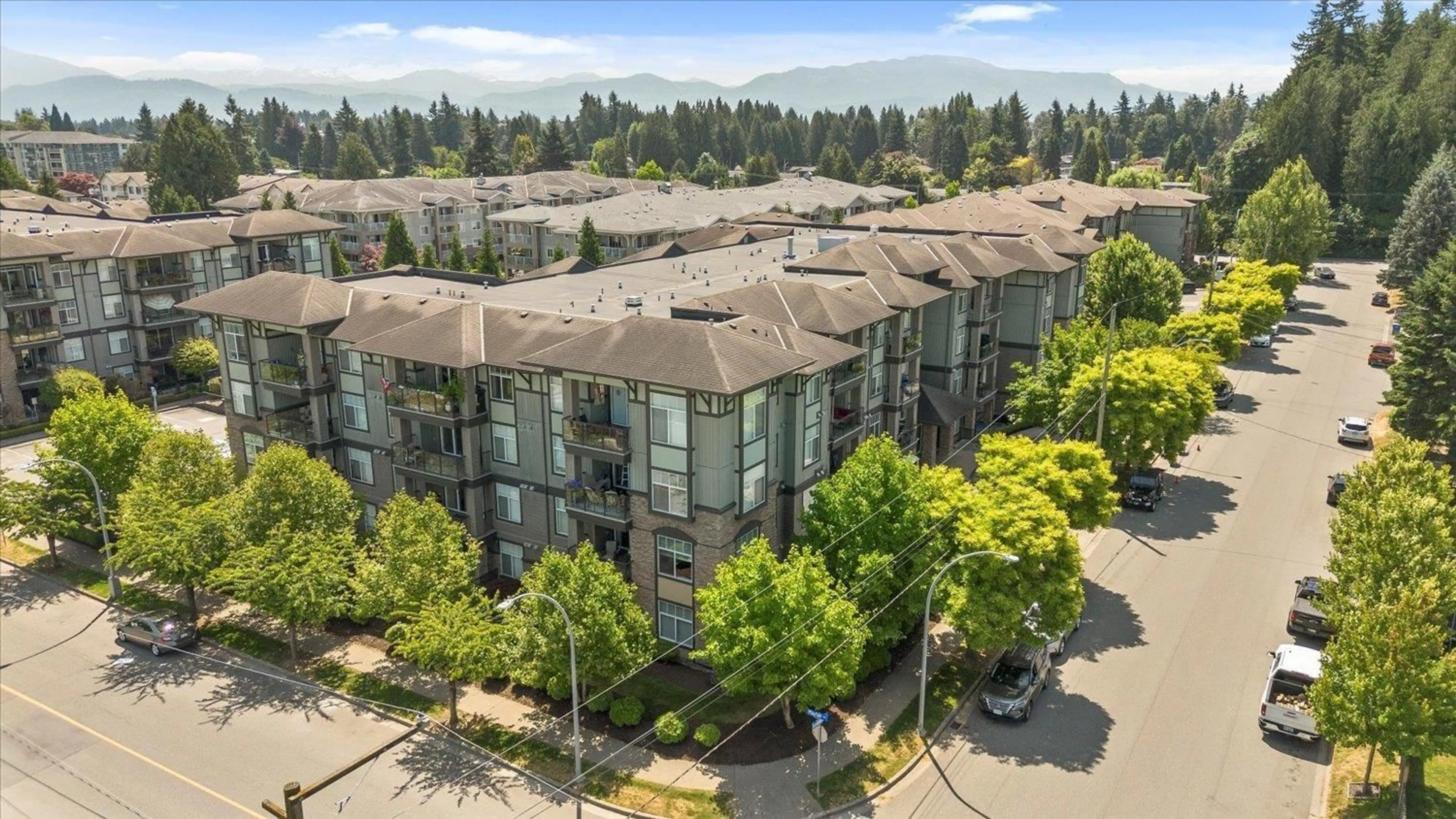 A pic from outside/outdoor area/front of a property/back of a property/a pic from drone, unknown for 402 - 2068 SANDALWOOD, Abbotsford British Columbia V2S3H6