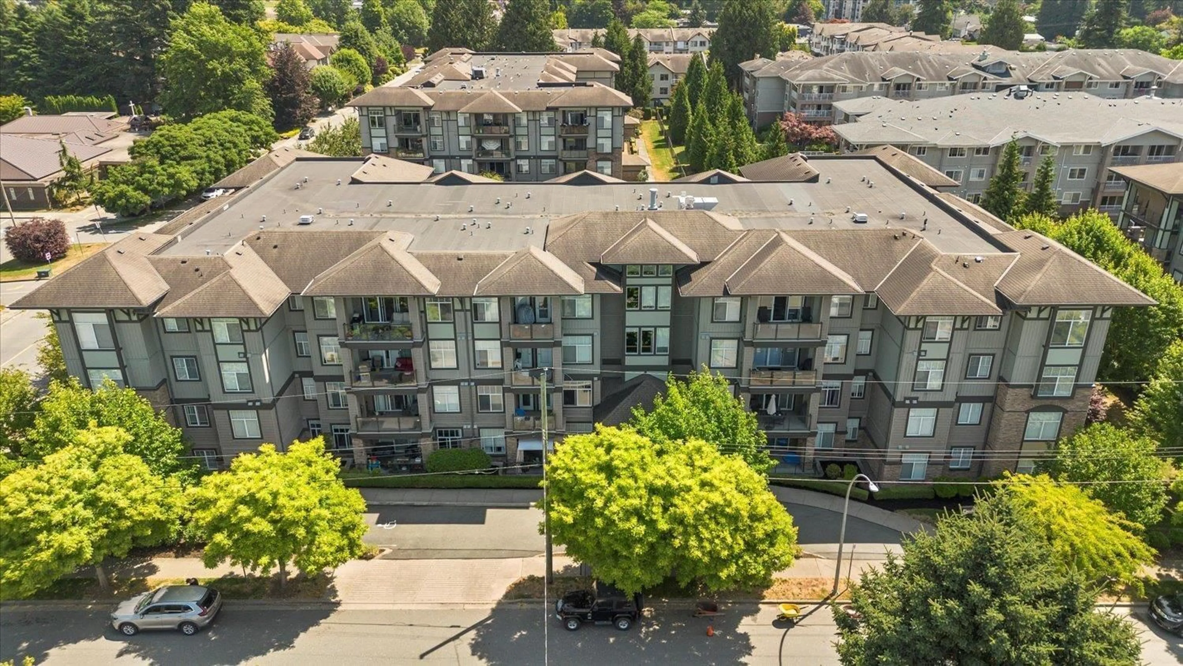 A pic from outside/outdoor area/front of a property/back of a property/a pic from drone, city buildings view from balcony for 402 - 2068 SANDALWOOD, Abbotsford British Columbia V2S3H6